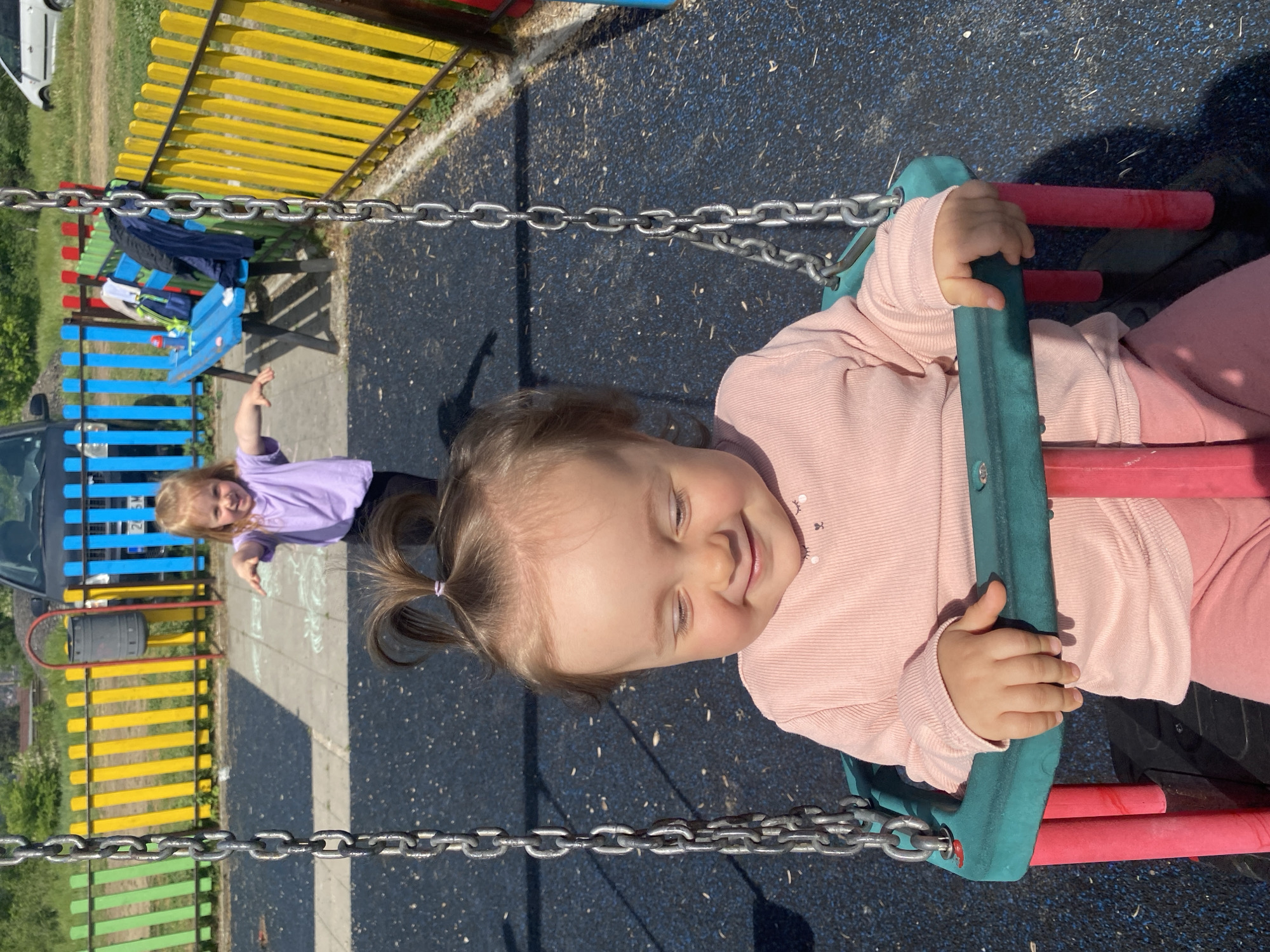 Child plays on swings at Blagoevgrad playground