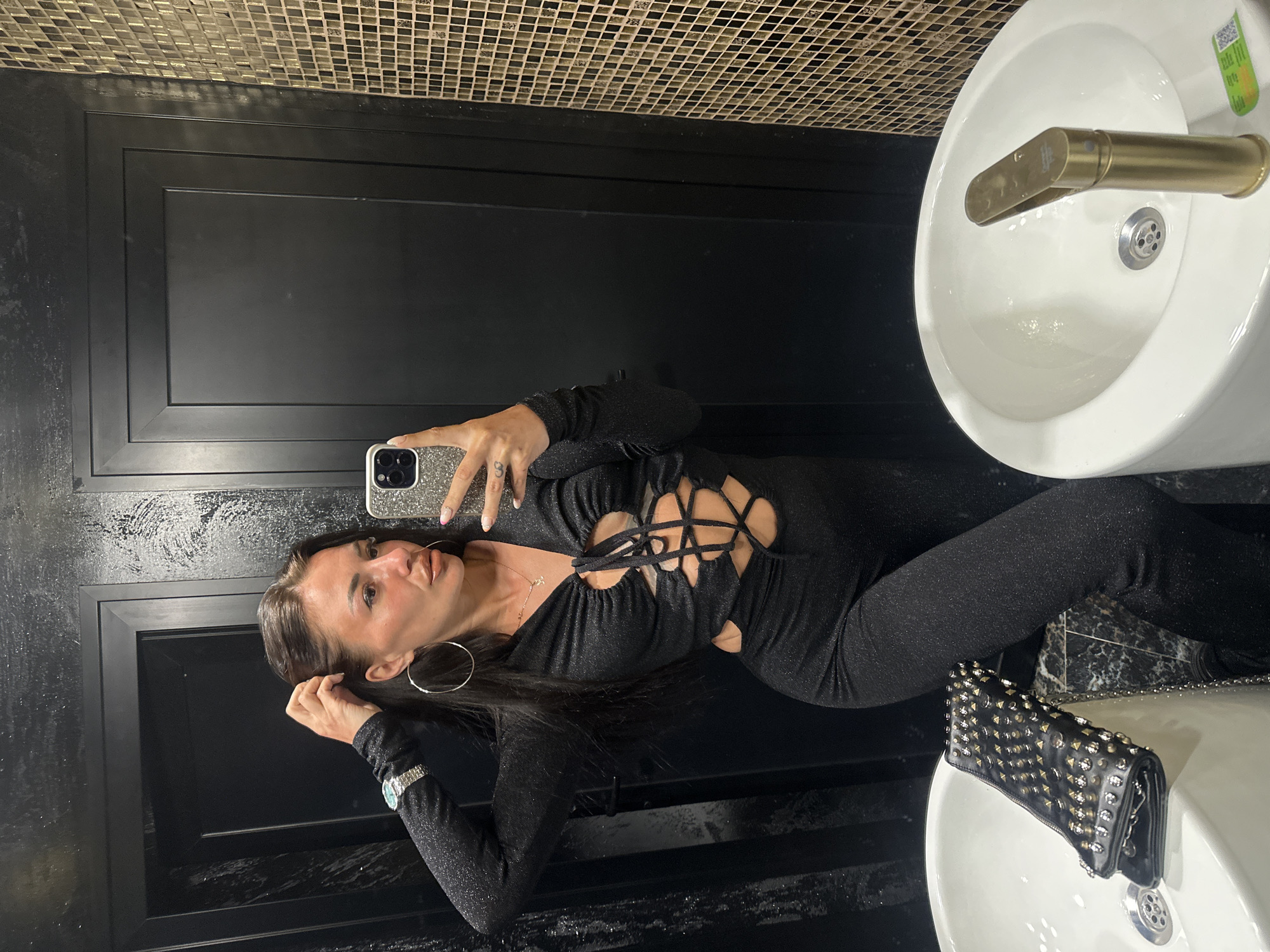 Woman takes mirror selfies in black outfit, Sozopol Bulgaria