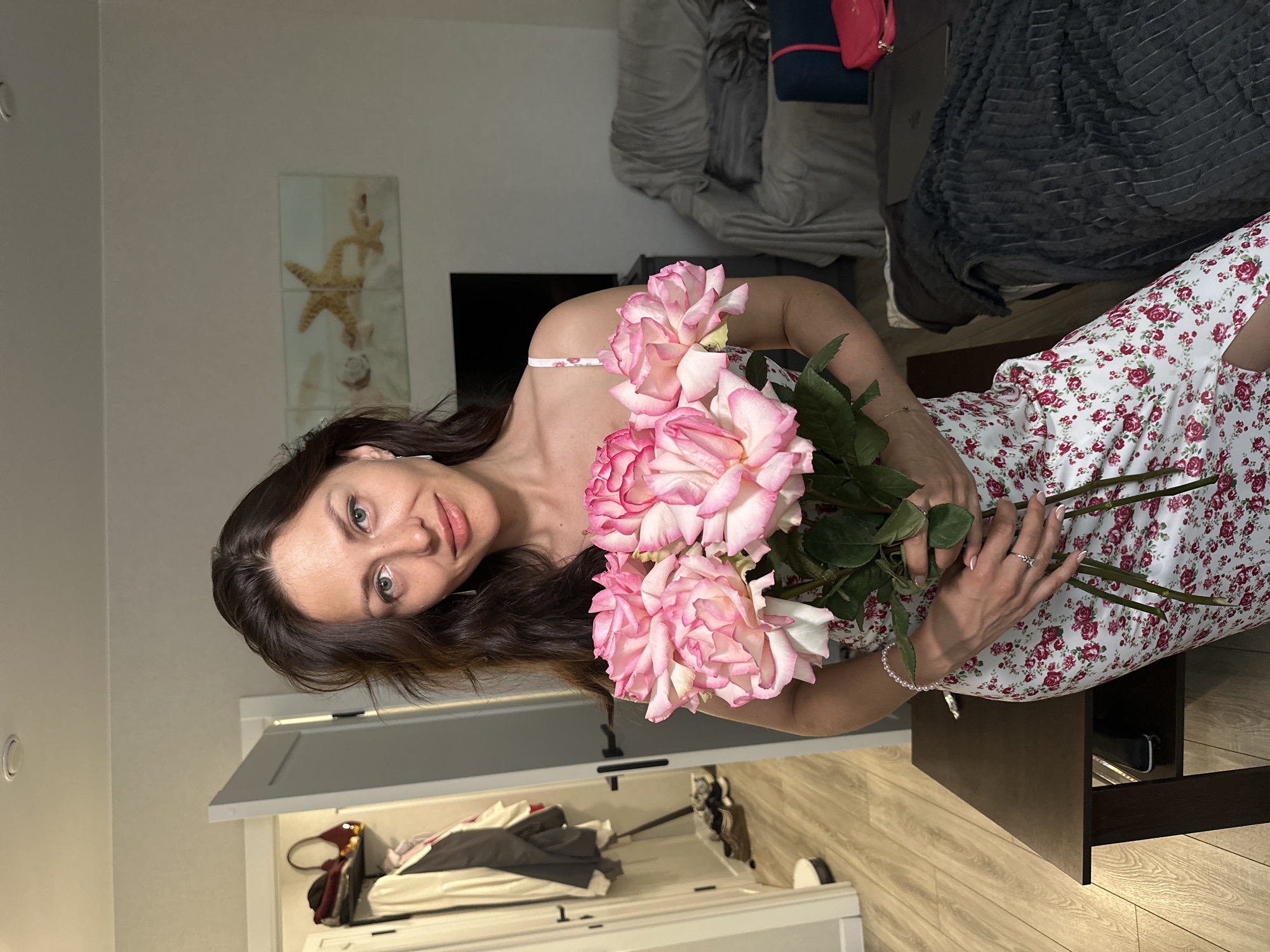 Pink roses and a floral dress in a Russian apartment
