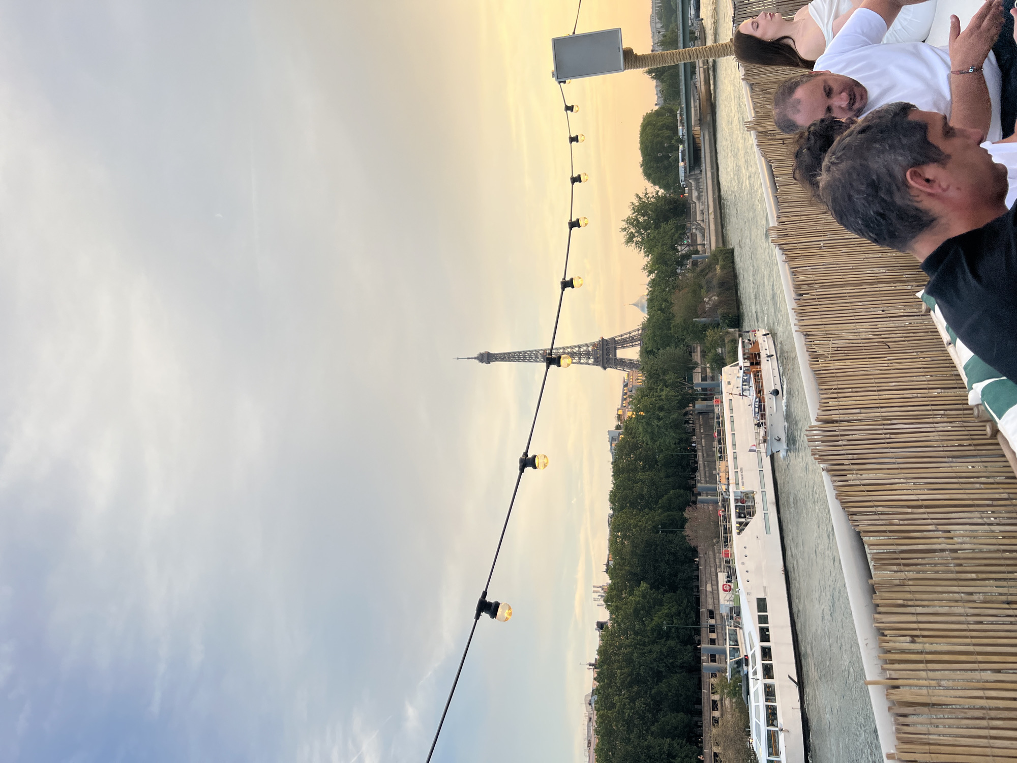Eiffel Tower silhouette against a warm Paris dusk sky