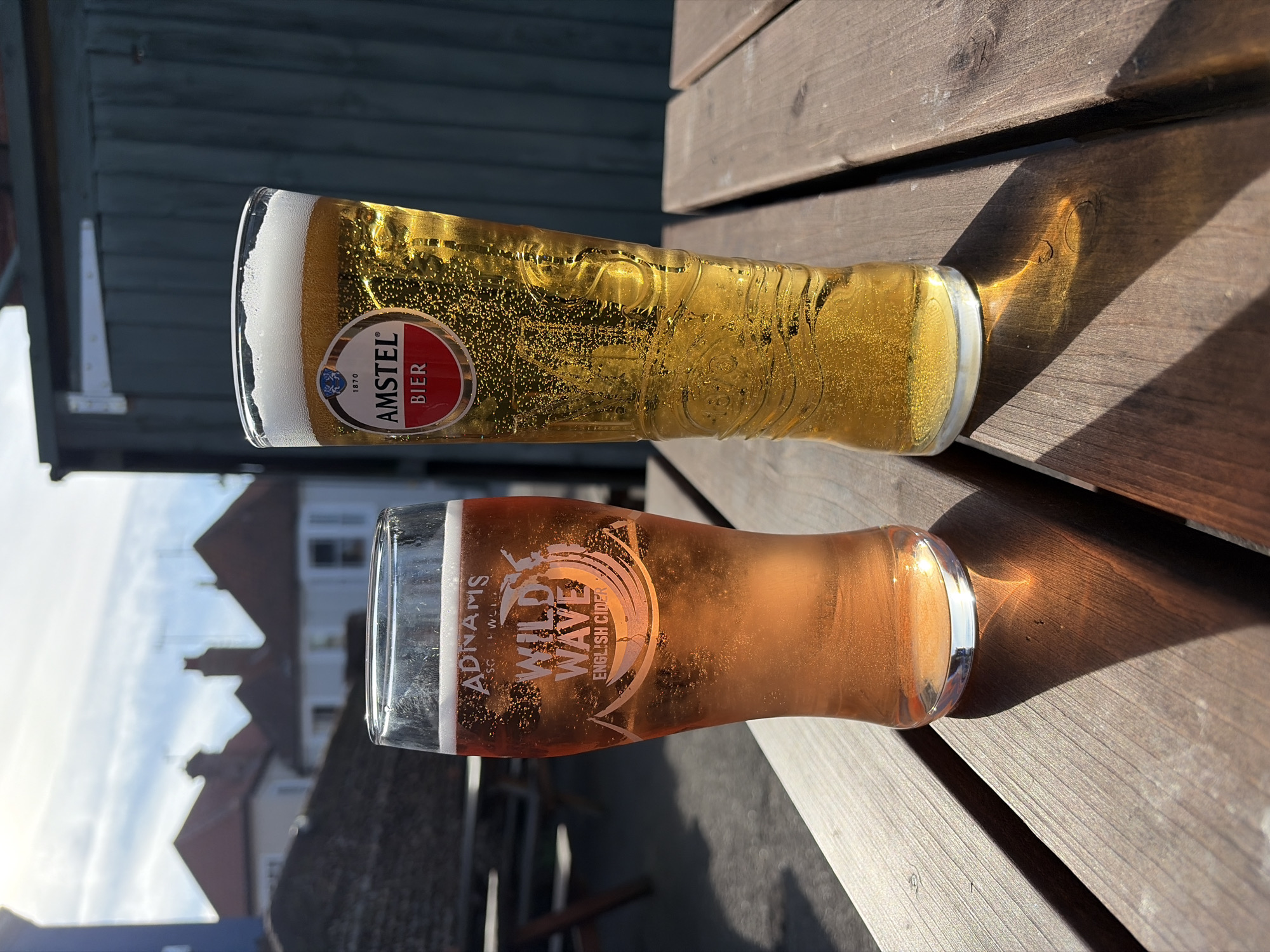 Beer and cider observed on wooden surface in East Suffolk