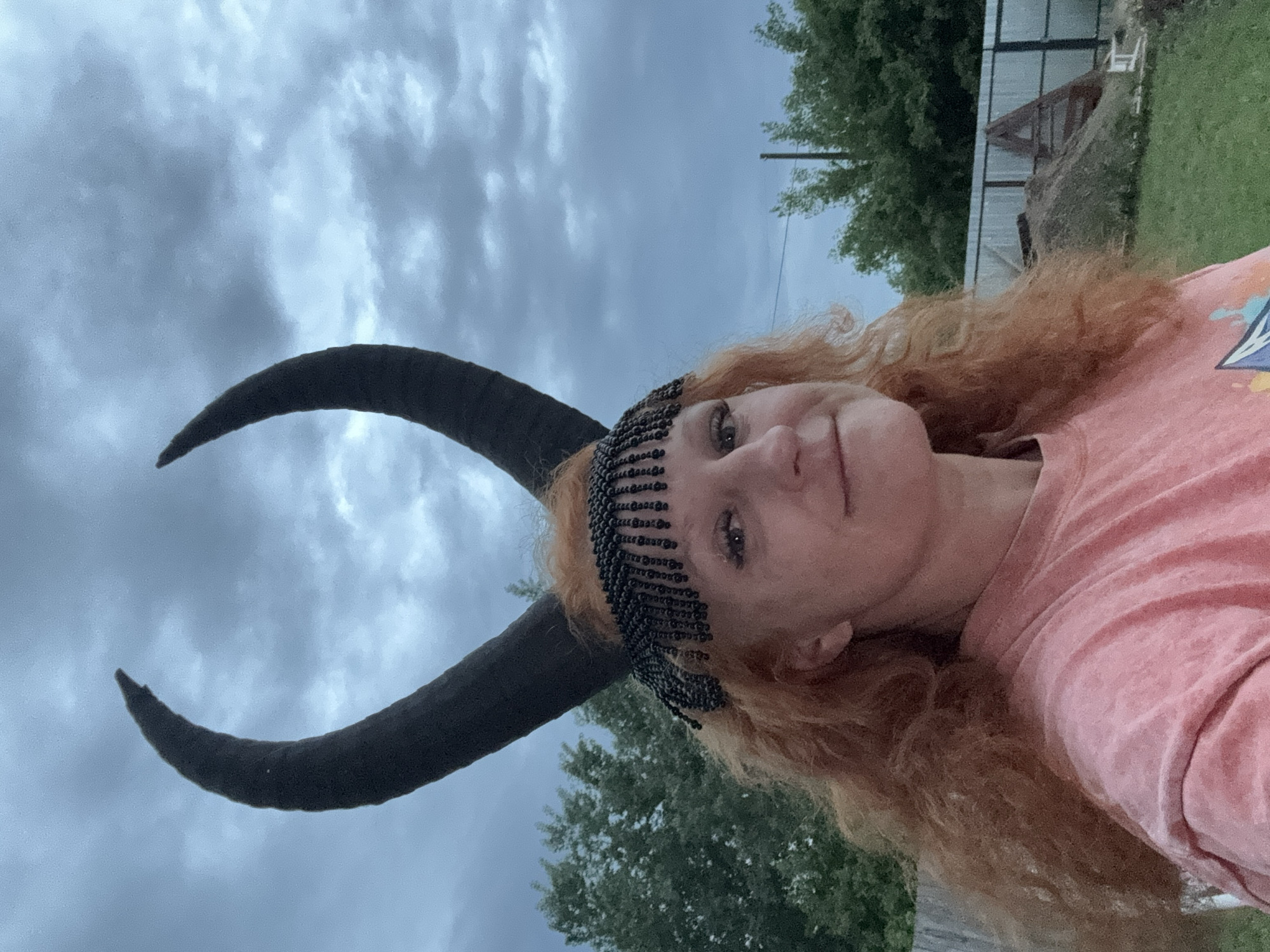 Woman in horned headpiece photographed around Chaikovsky, Russia