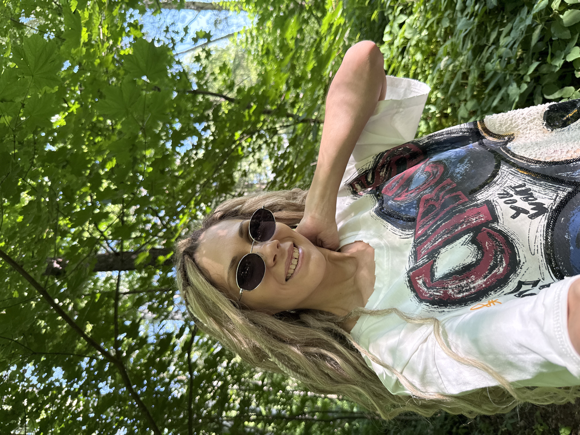 Woman takes selfie in Russian forest setting