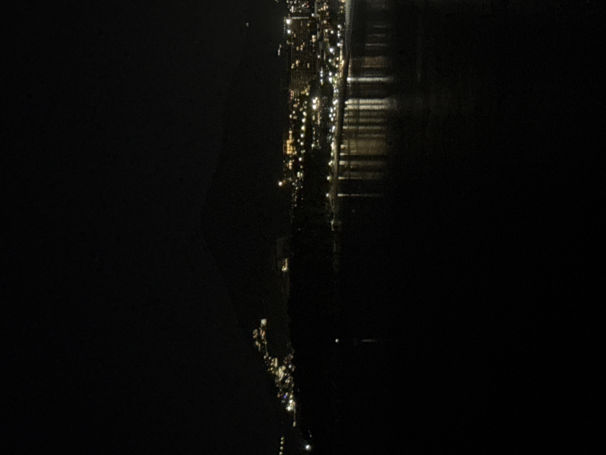 Nighttime aerial views capture illuminated Rafailovići coastline under full moon