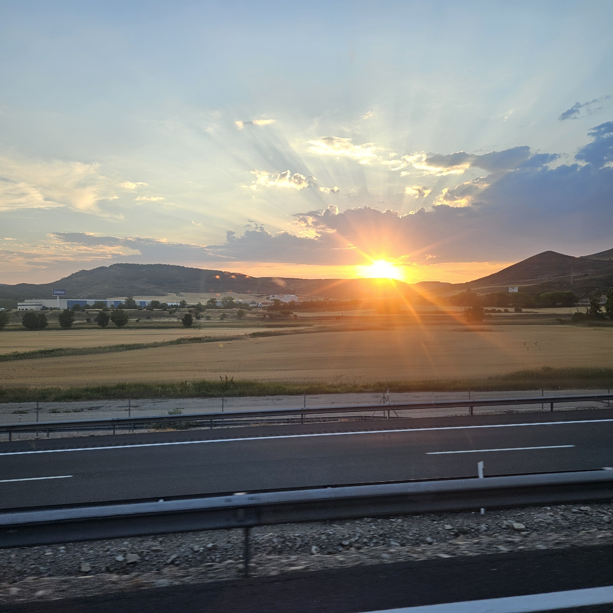 Rays fan out over the Castilian countryside at sunset