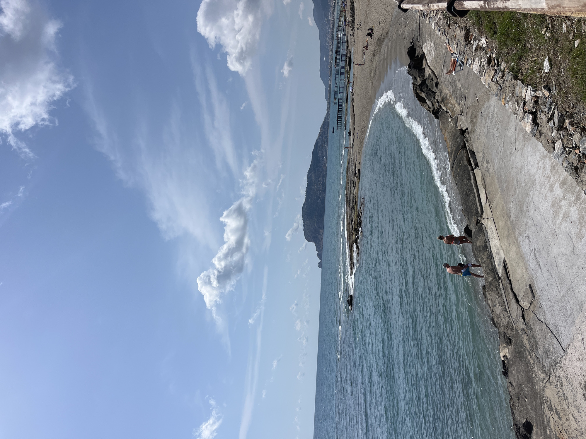 Beachgoers gather along Alanya shoreline on spring morning