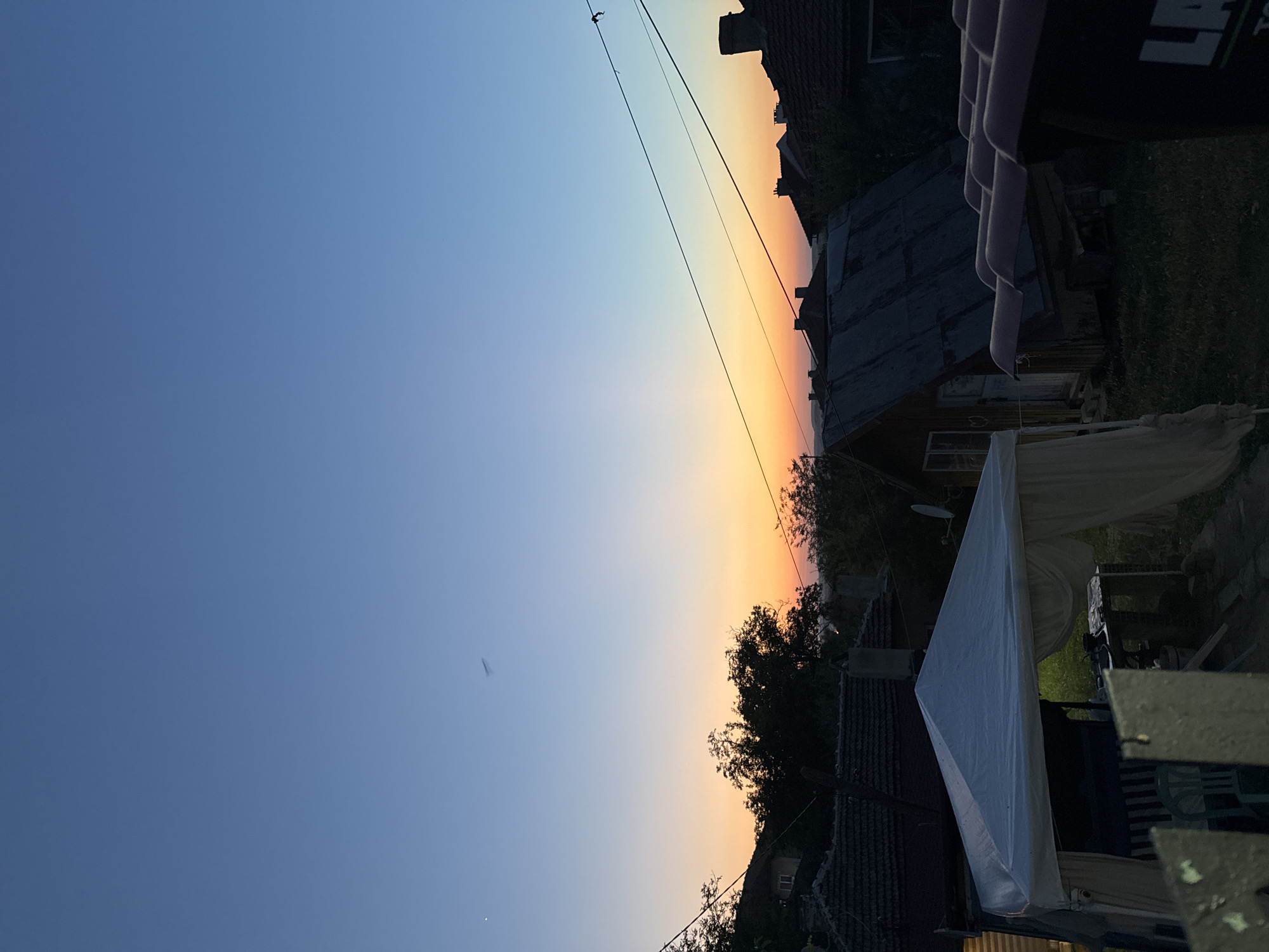 Ribbon crafting indoors as the sun sets over Sredets