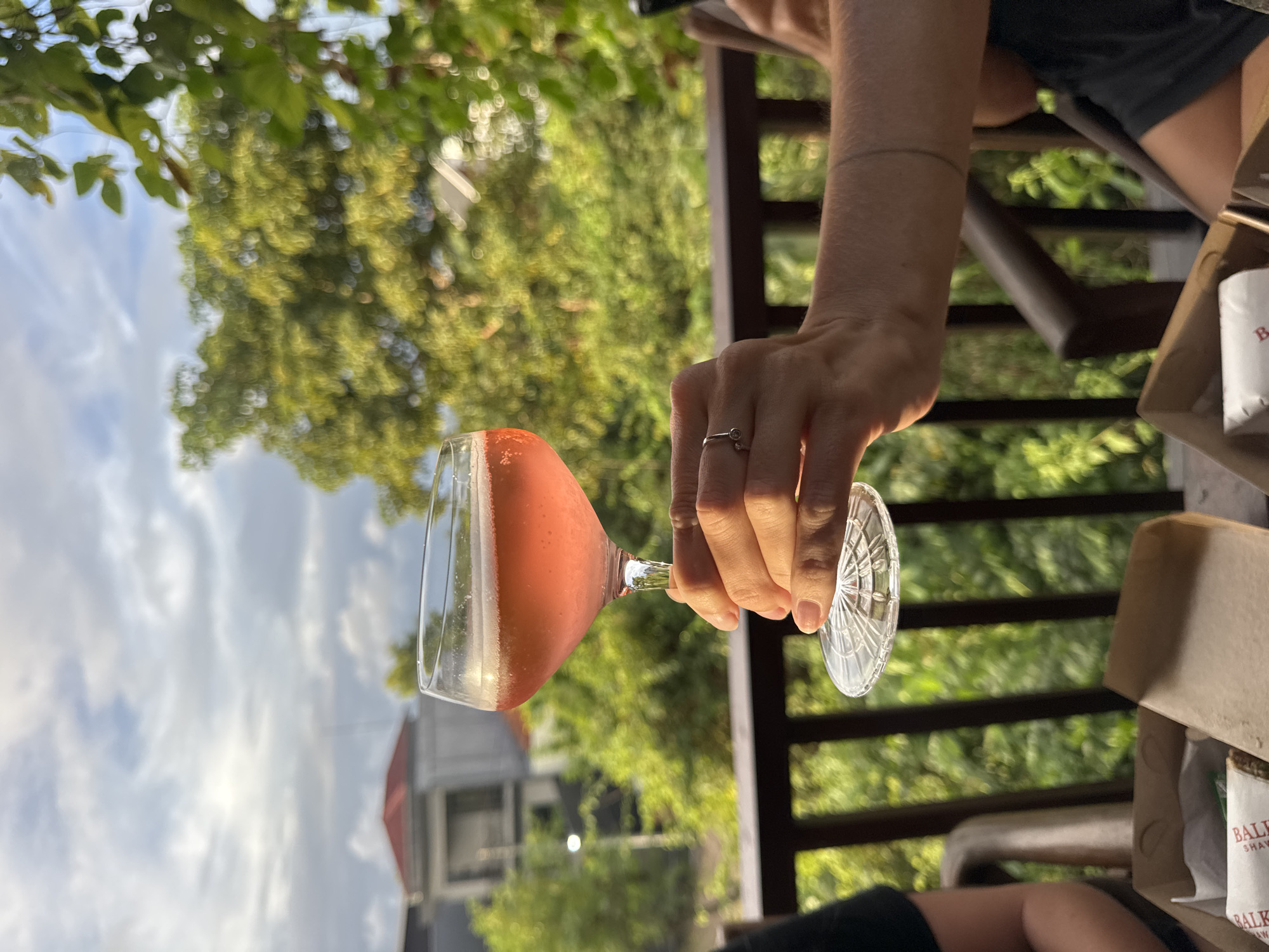 Casual patio lunch with pink cocktails documented in Kuta Selatan