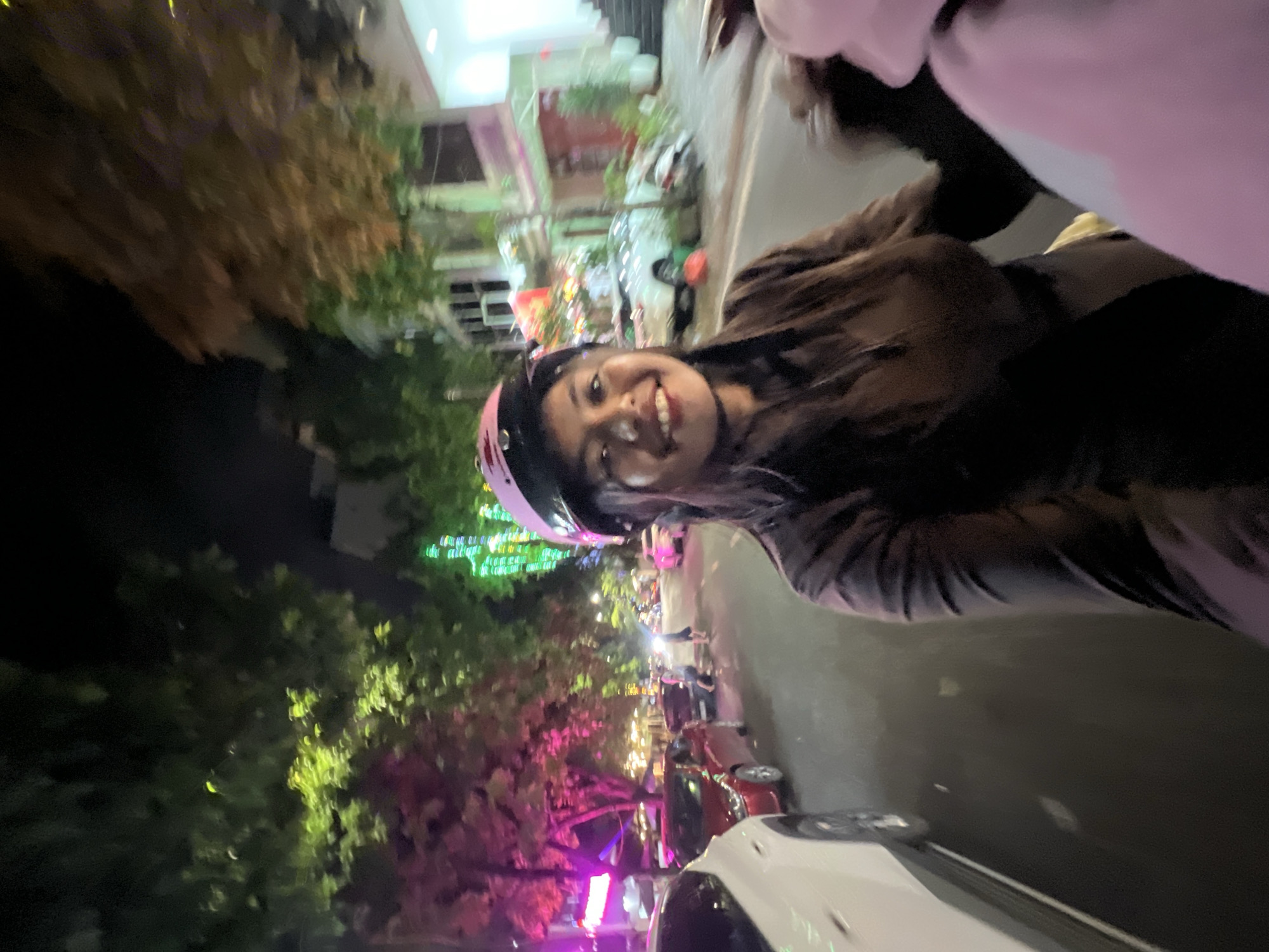 Late-night motorcycle selfies on wet streets in Minh Xuân Ward