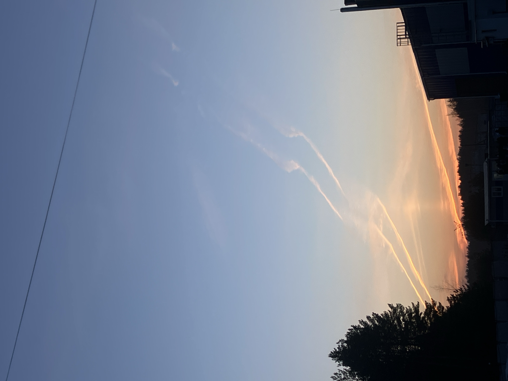 Aircraft contrails spotted over Noviy, Russia afternoon sky
