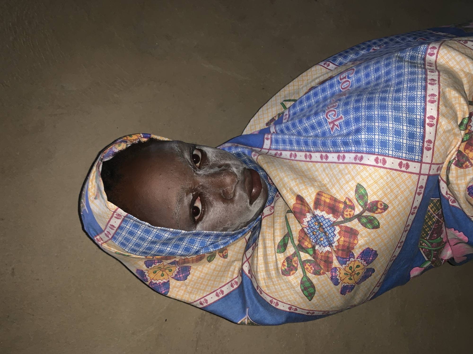 Woman receives facial mask treatment in Agban, Nigeria