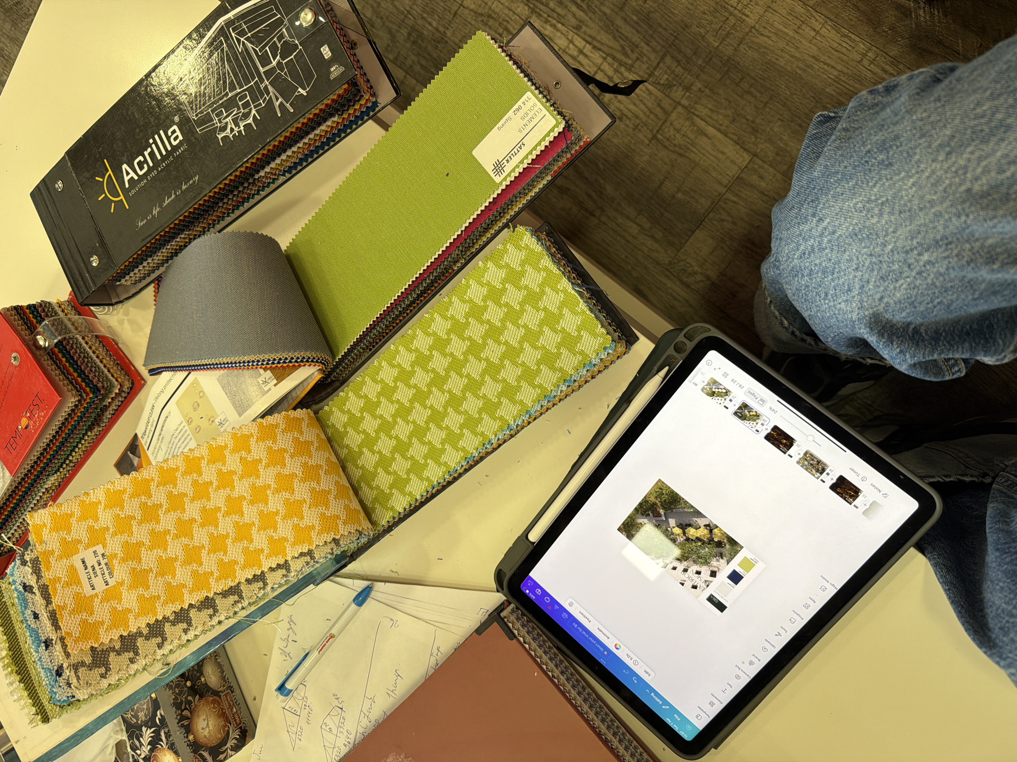 Design materials and fabric swatches documented in Yerevan workspace