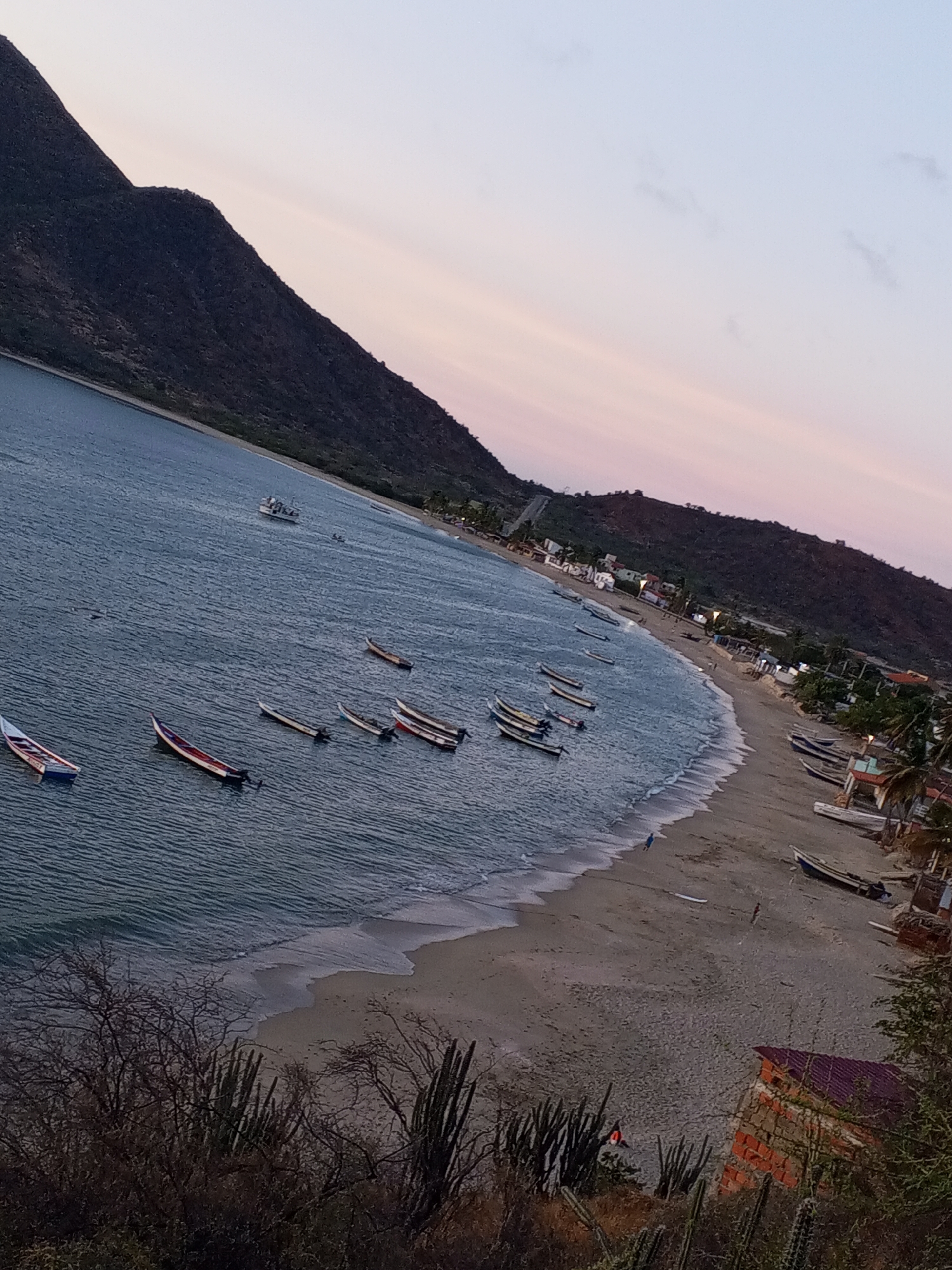 Coastal sunset observed over mountainous horizon April 21