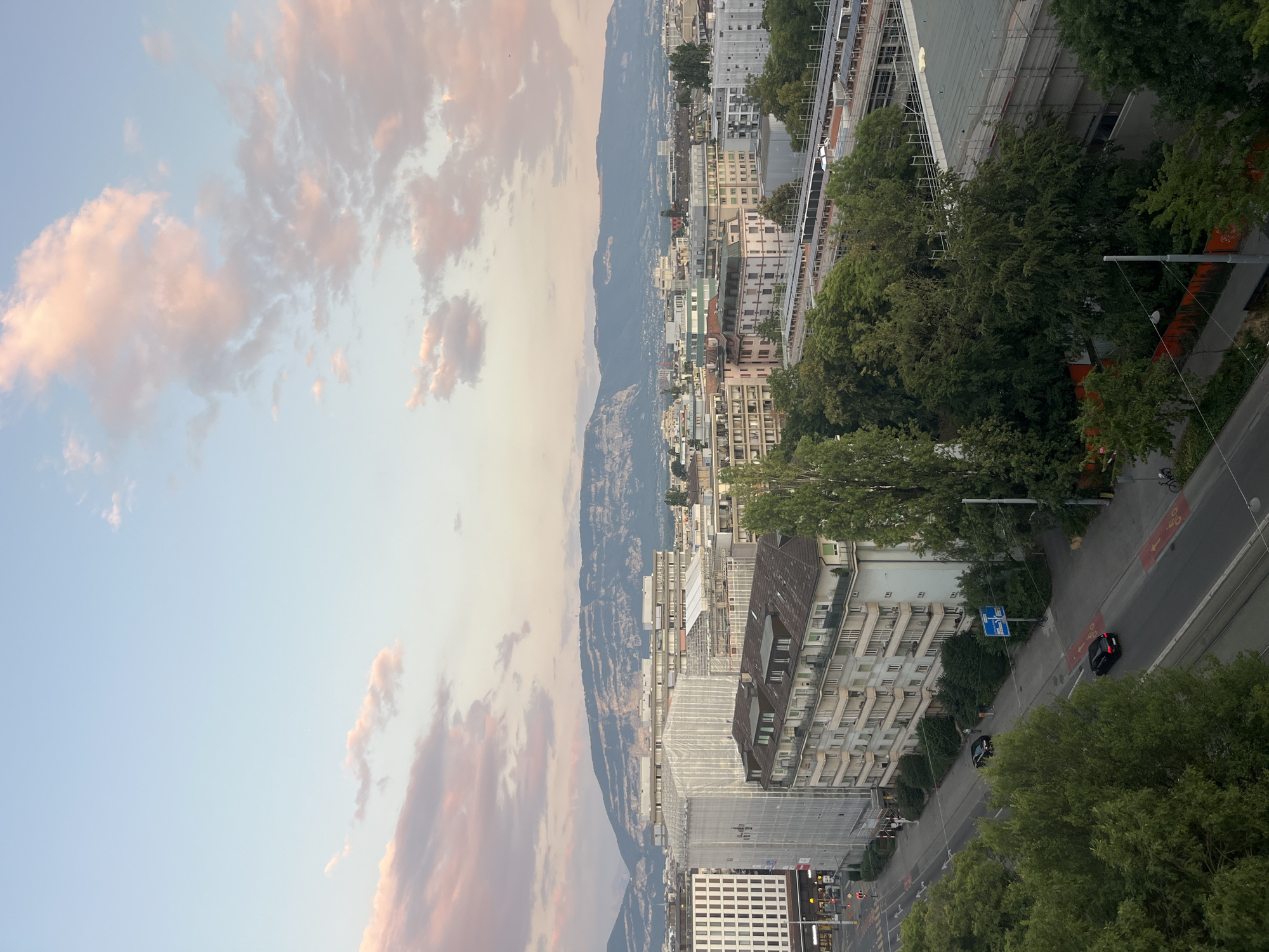 Geneva at dusk: streets, sculptures, and skyline