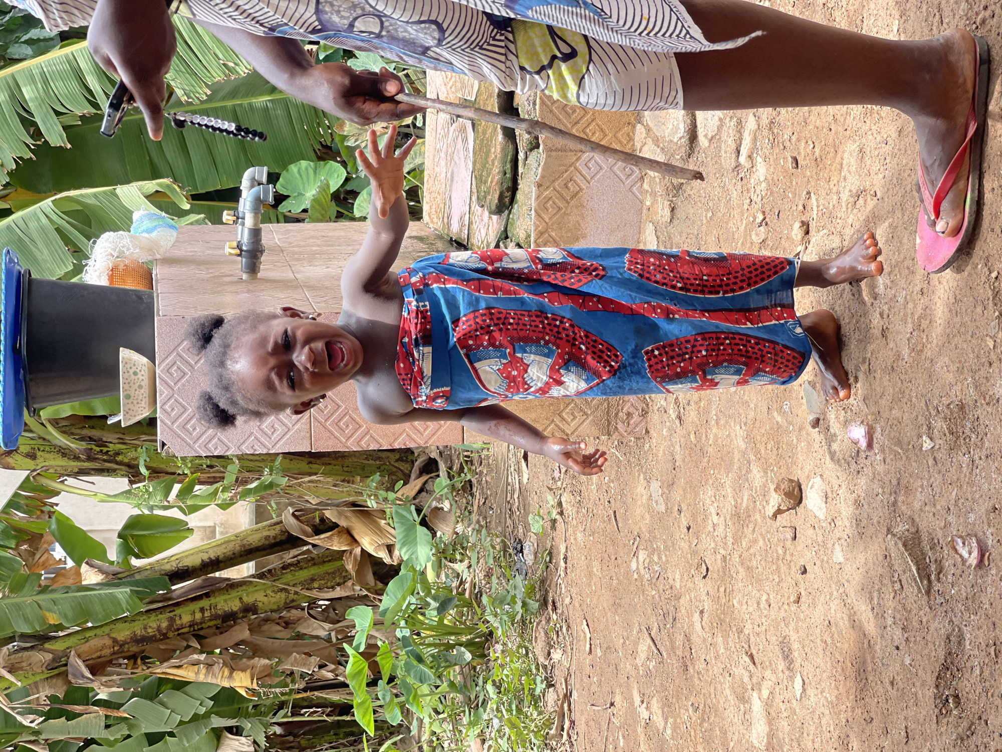 Daily life documented in Akwanga: food processing, tailoring work