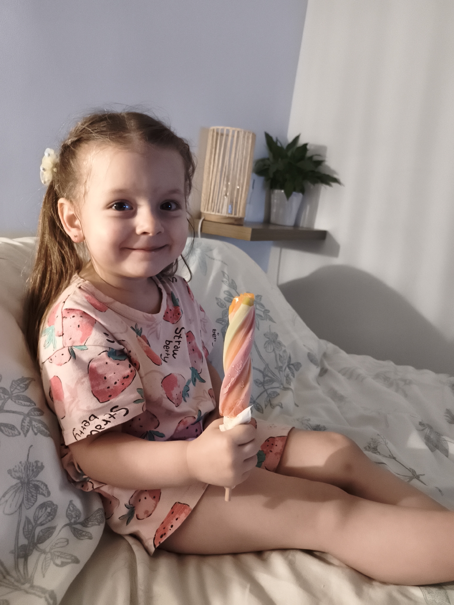Summer evening snack on the bed, strawberry pajamas in France