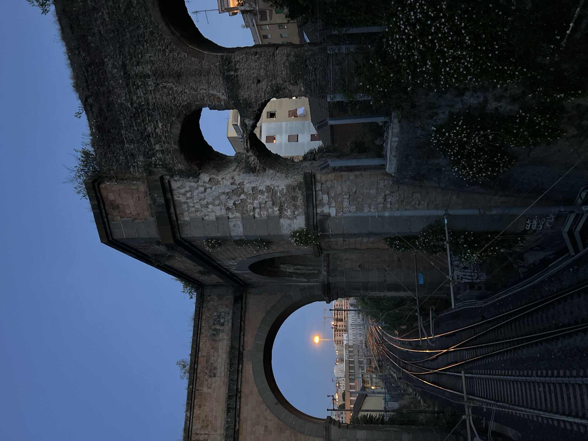 Rome twilight captured through ancient aqueducts and modern streets