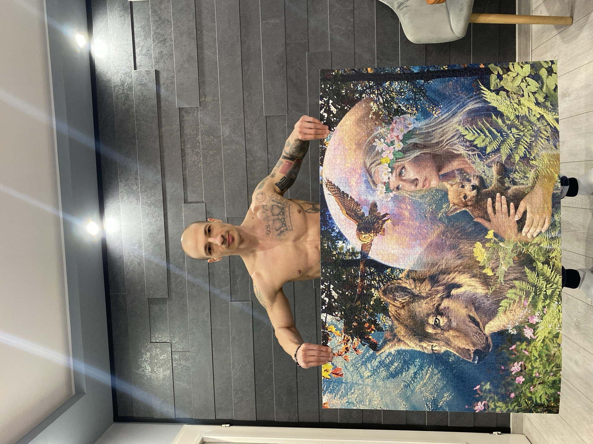 Man displays completed jigsaw puzzle in Pleven Bulgaria