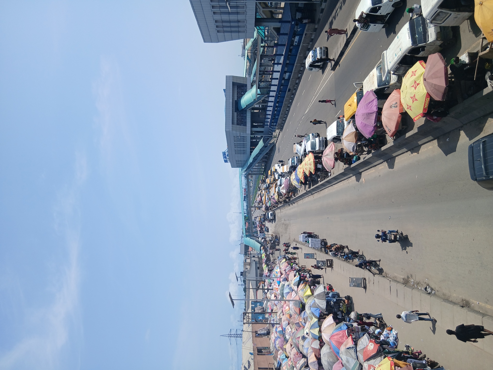 Street vendors line busy highway in Alaiyabiagba, Nigeria