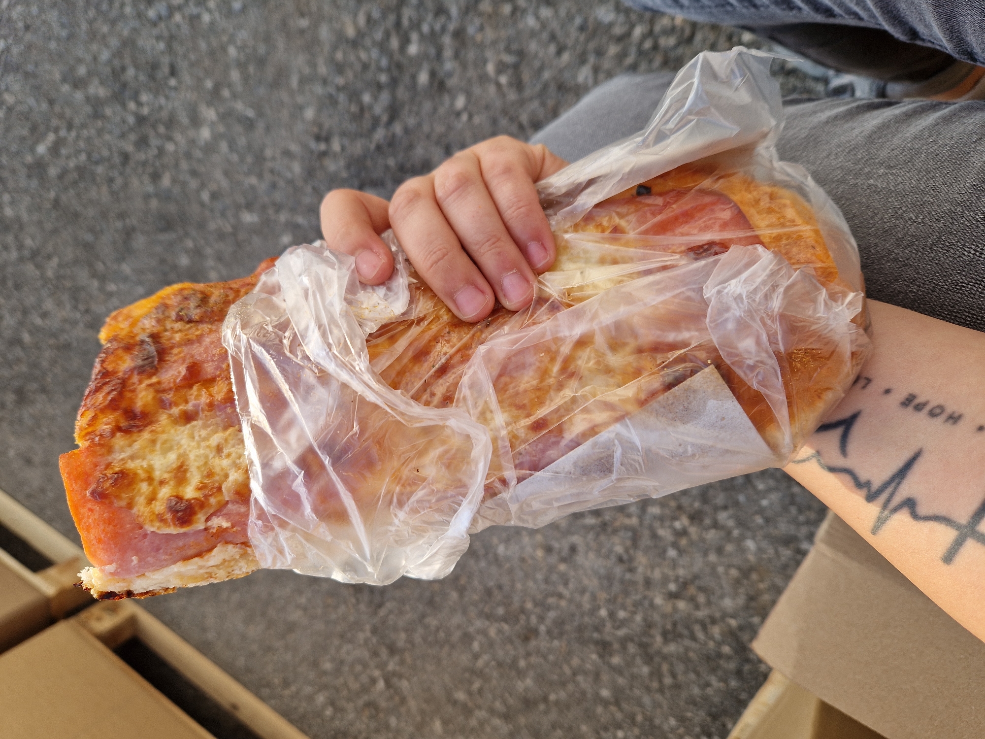 Boxes on pallets and a pizza slice, Bahovitsa