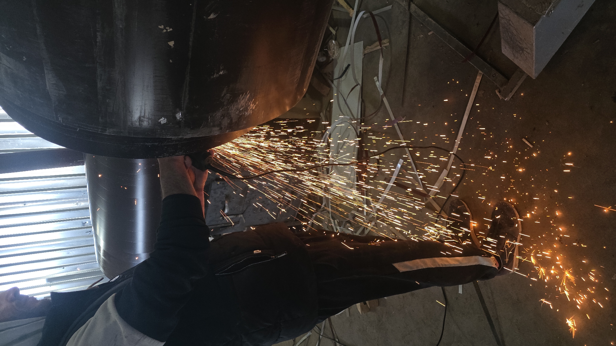 Worker performs metalworking operations at Bulgarian industrial workshop