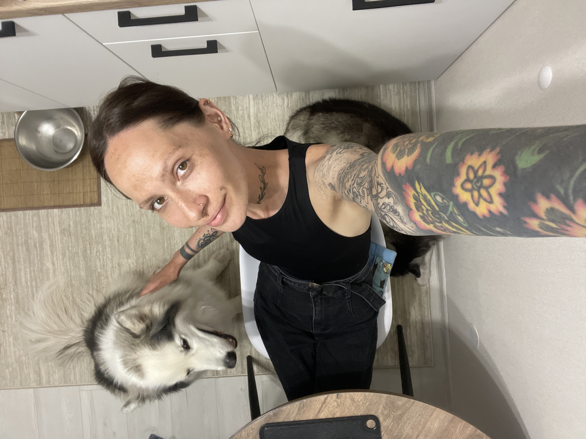 Woman takes selfie with dogs in Izhevsk home
