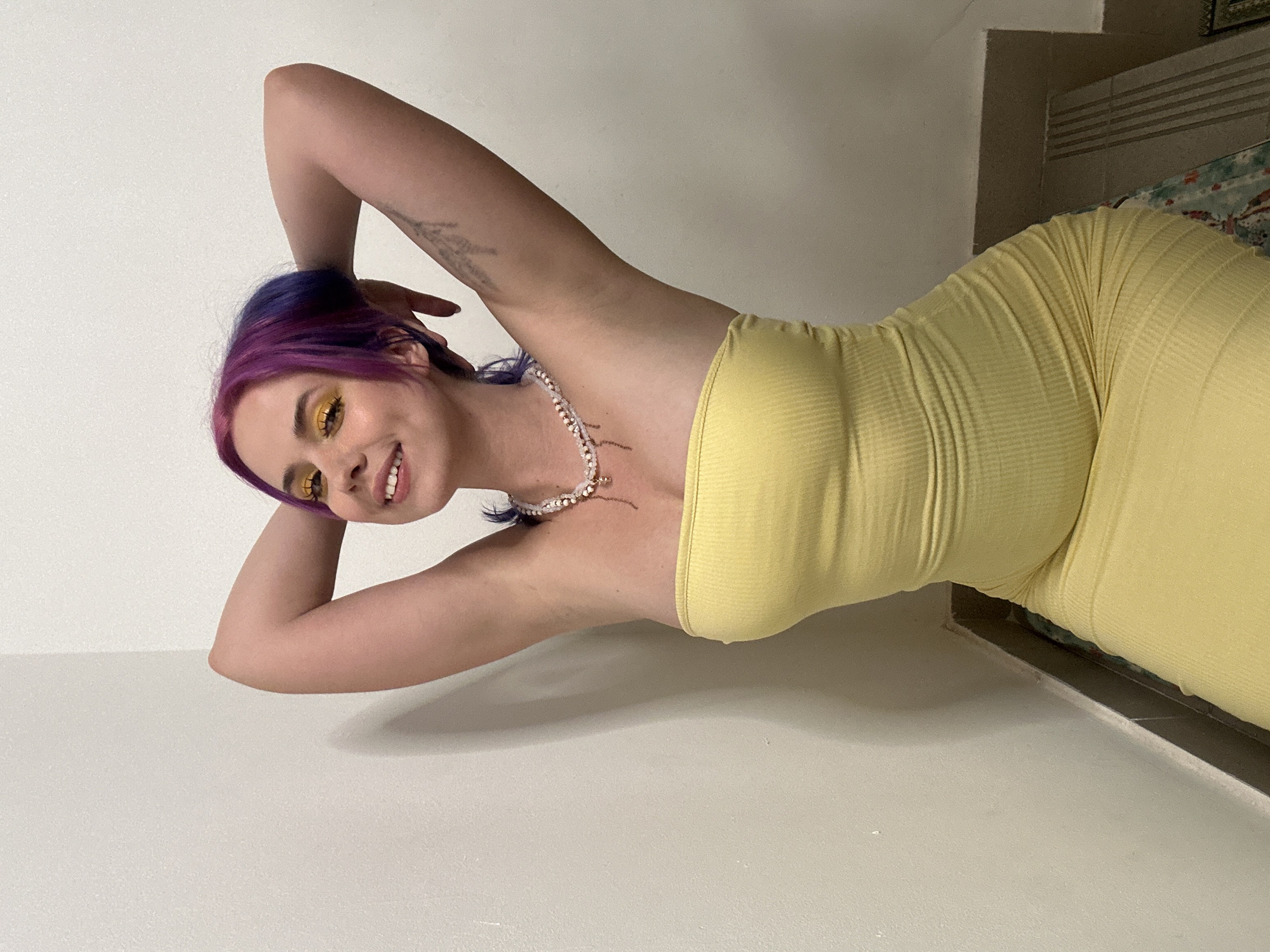 Woman poses for photo session in Zagreb wearing yellow dress