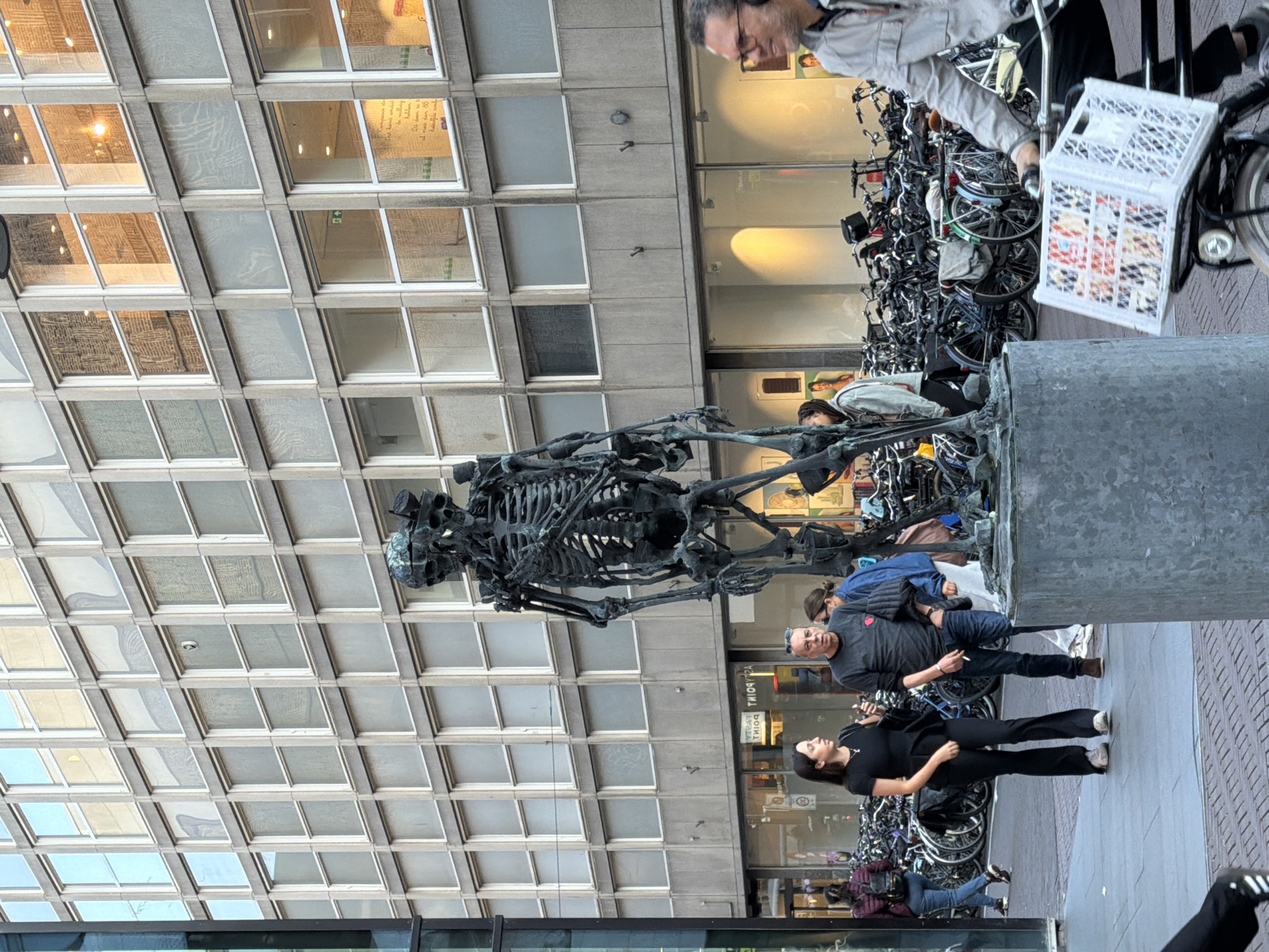 The Hague city center: sculptures, cyclists, and busy shopping streets
