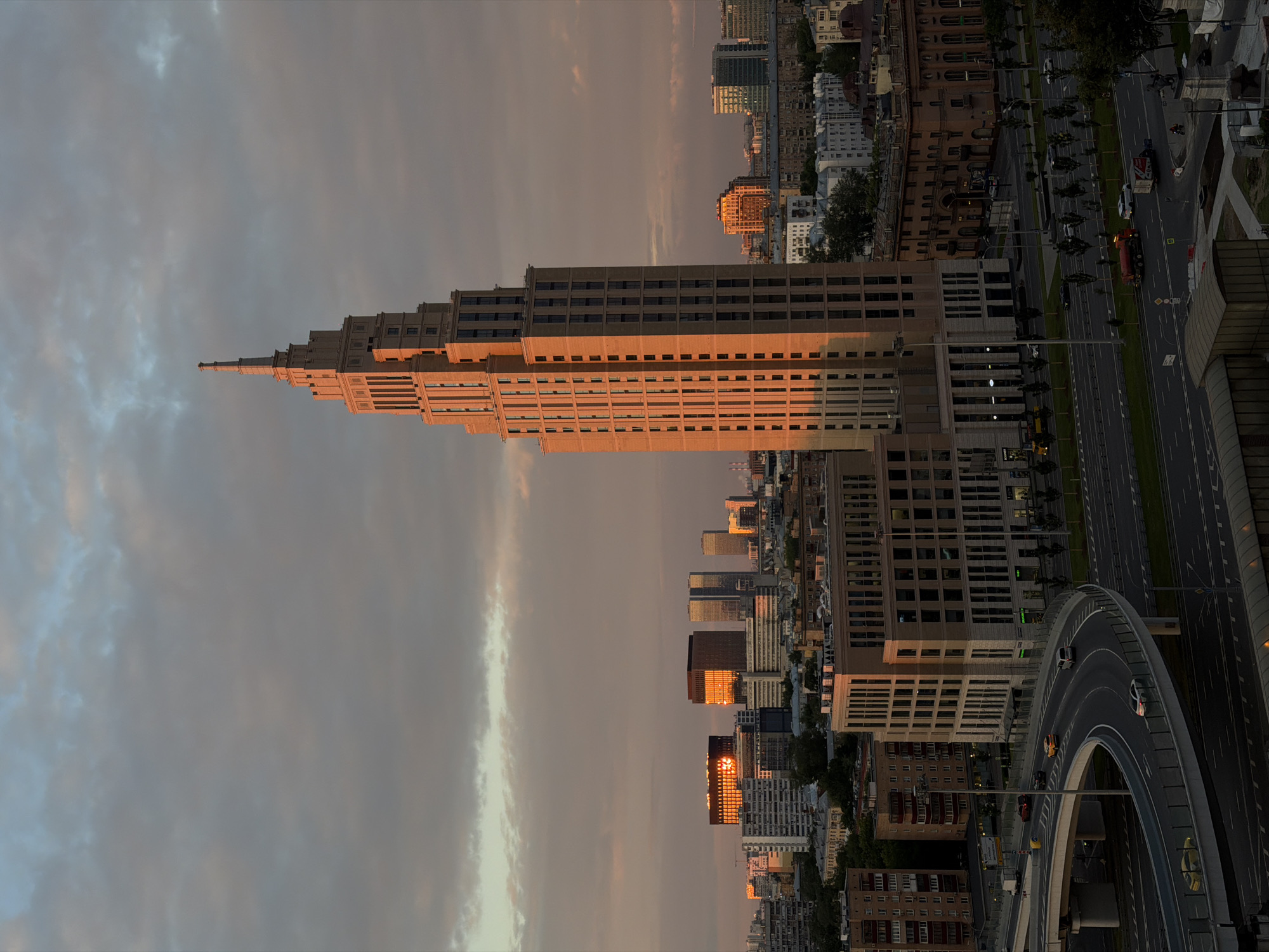 Moscow skyline at golden hour, brutalist towers and evening traffic