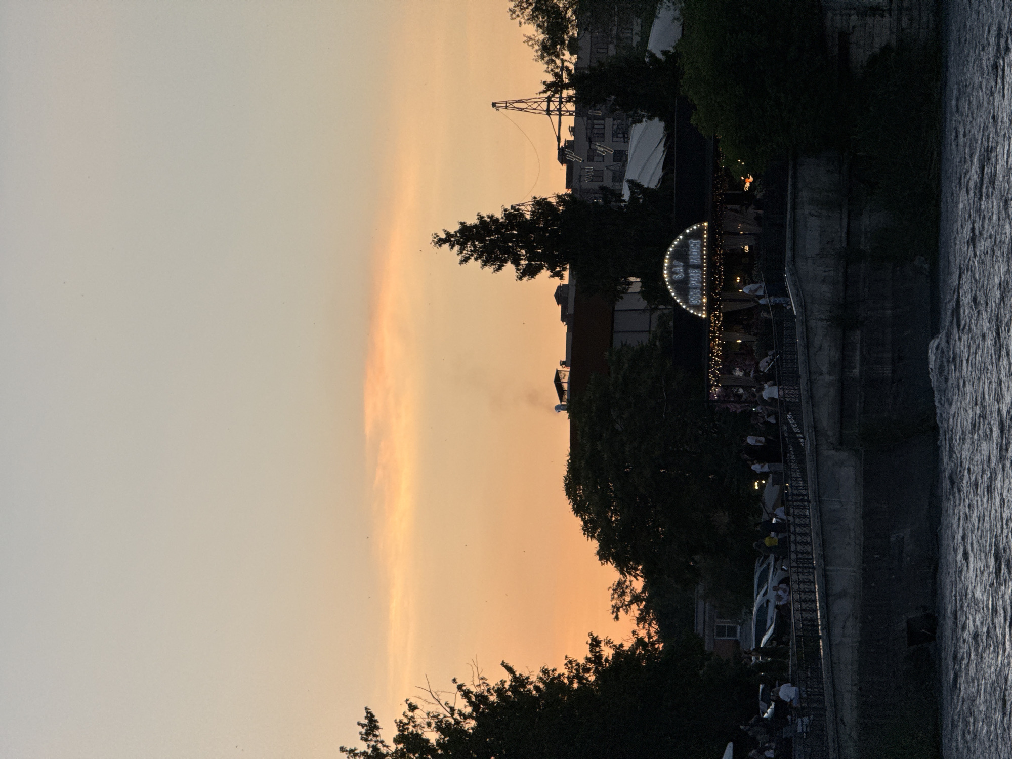 Sunset over an industrial riverfront in Karaman, Russia