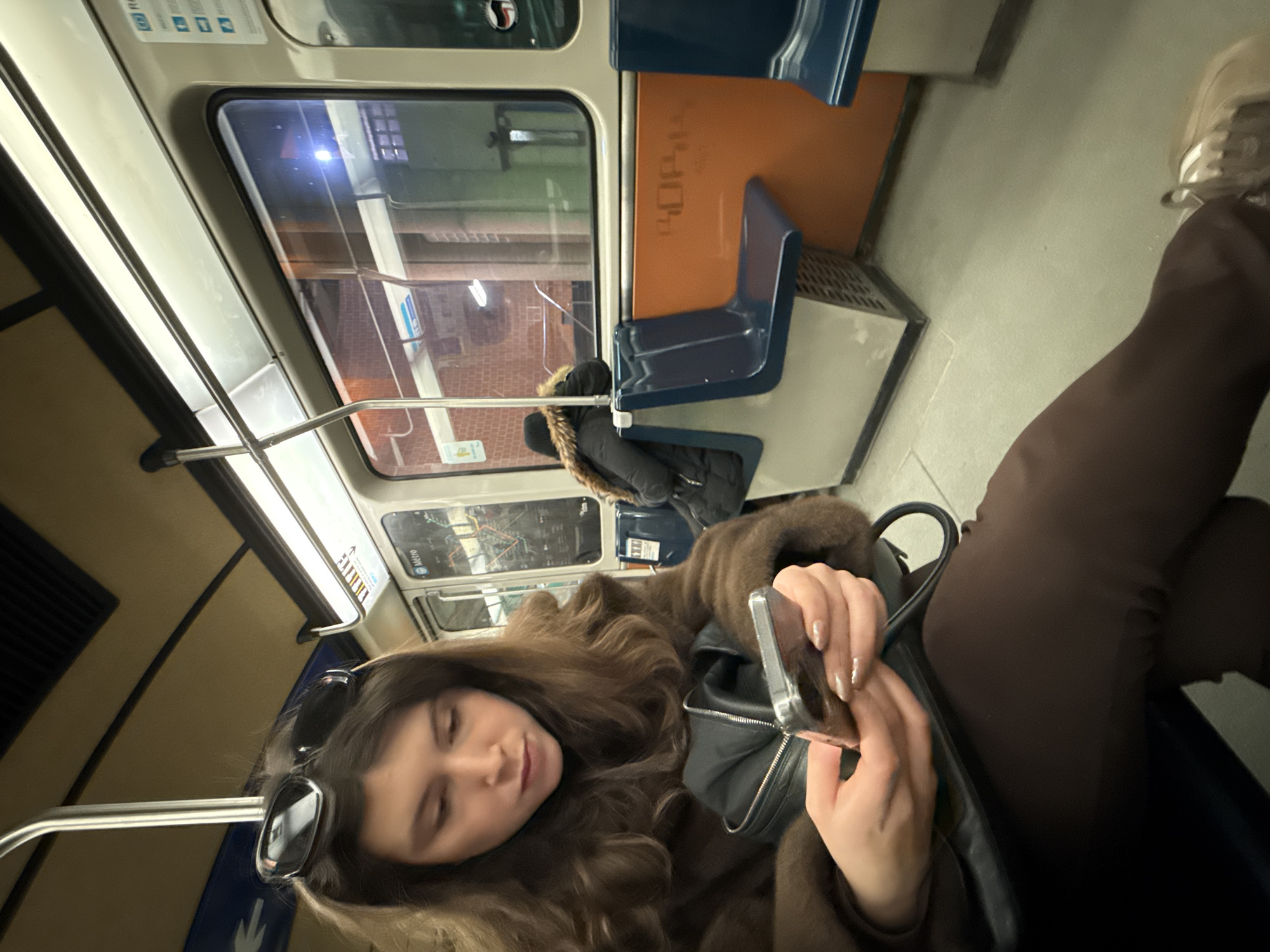 Evening commuters use phones, shop vintage items in Montreal