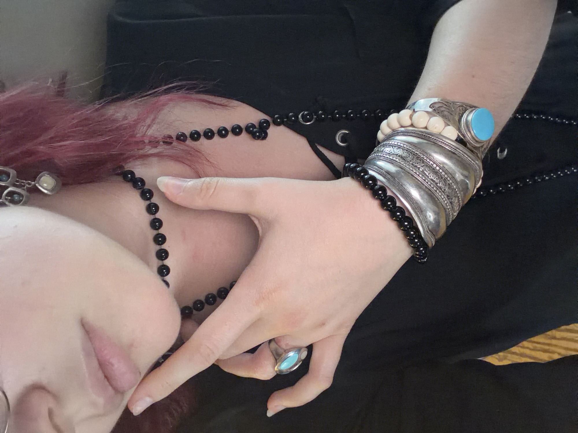 Stacked silver jewelry and bold accessories in Chelyabinsk