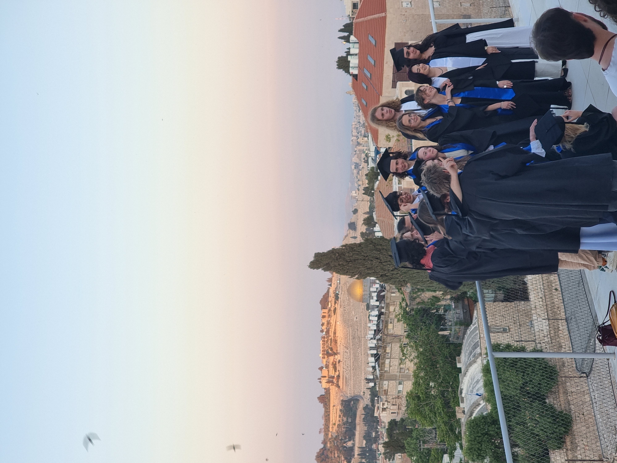 Jerusalem graduation ceremony features iconic skyline backdrop at sunset