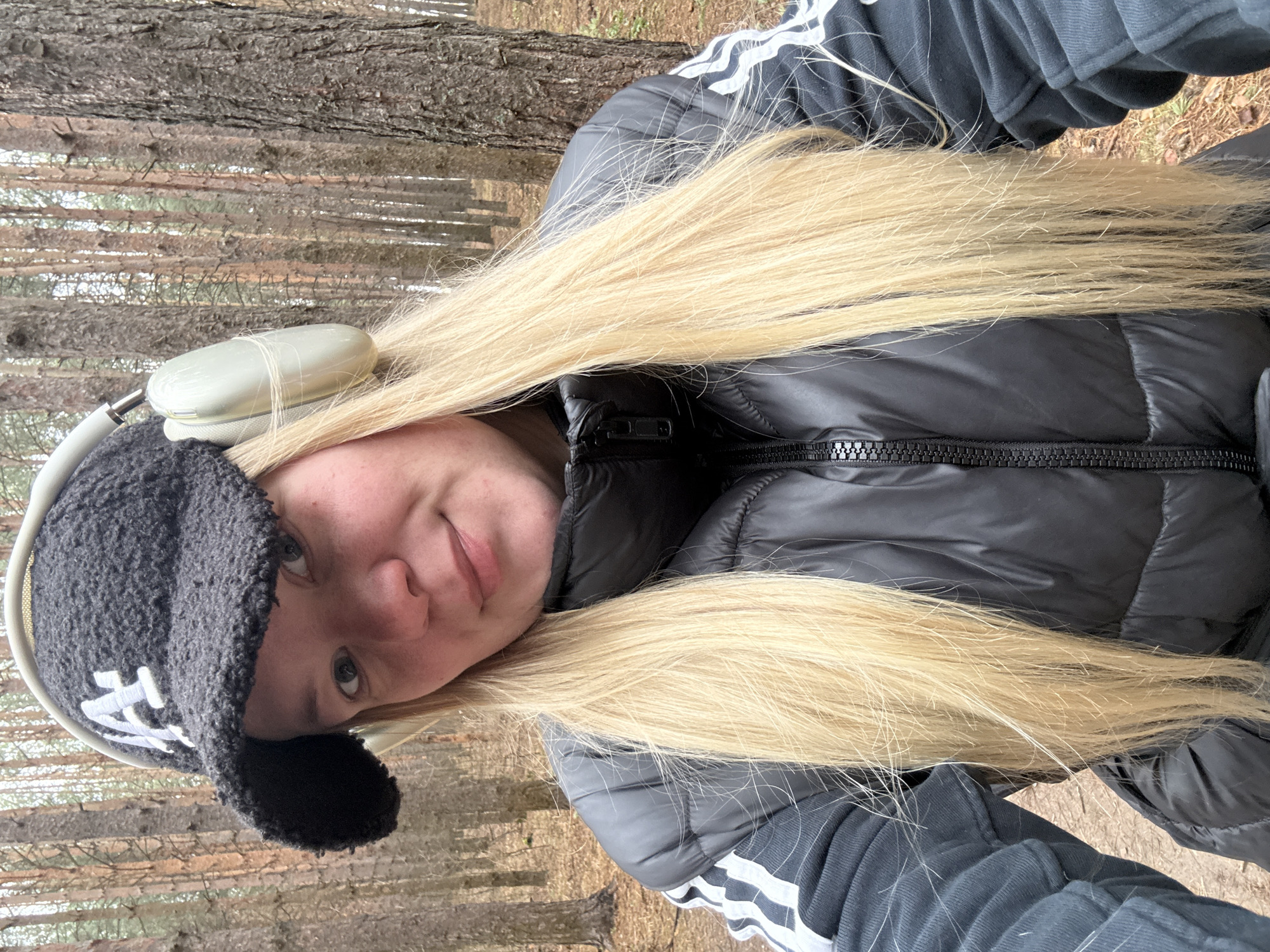 Woman takes selfies during morning walk in Chaikovsky forest