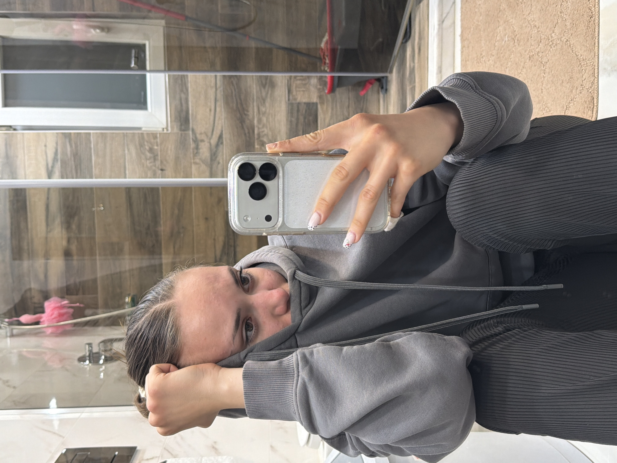 Woman takes bathroom selfie in Buhovo, Bulgaria