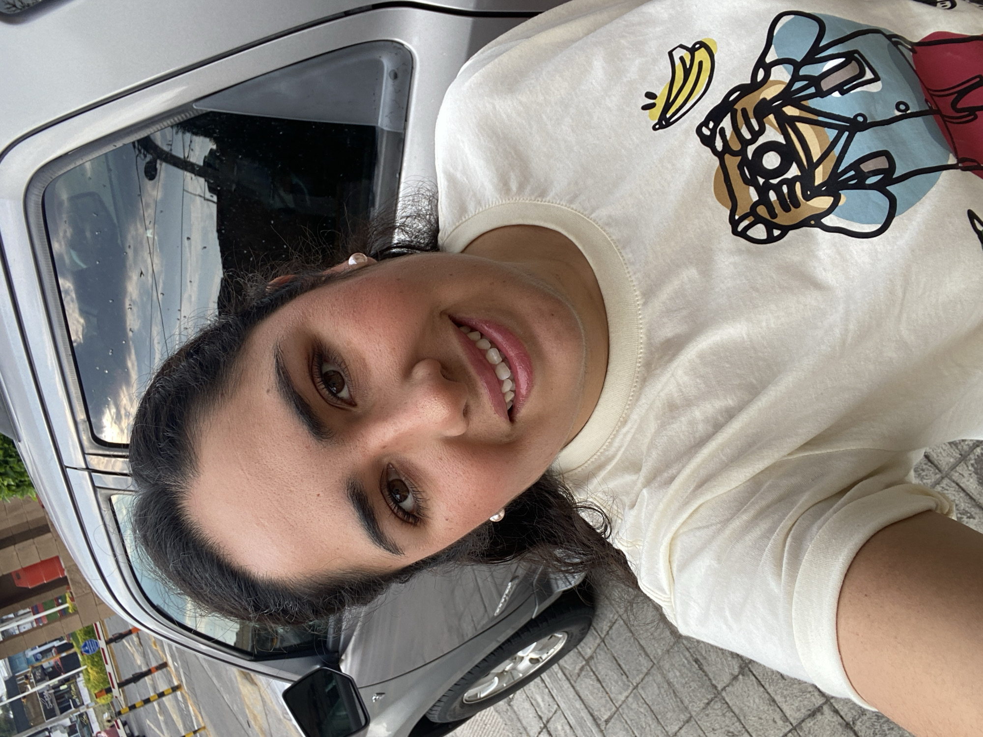 Woman photographed smiling on street in Tlaxcalancingo, Mexico
