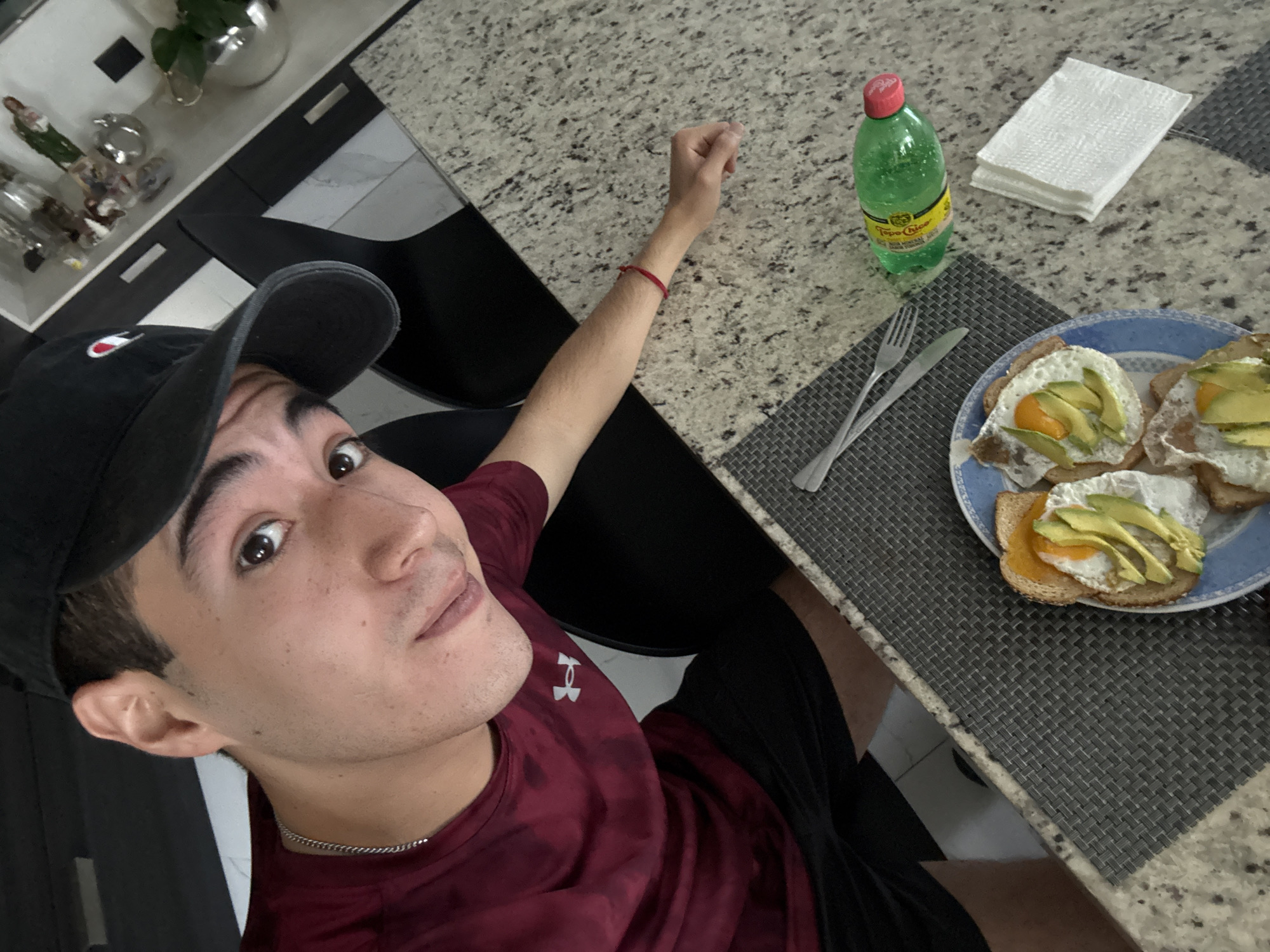 Young man takes selfie with breakfast in Mexico