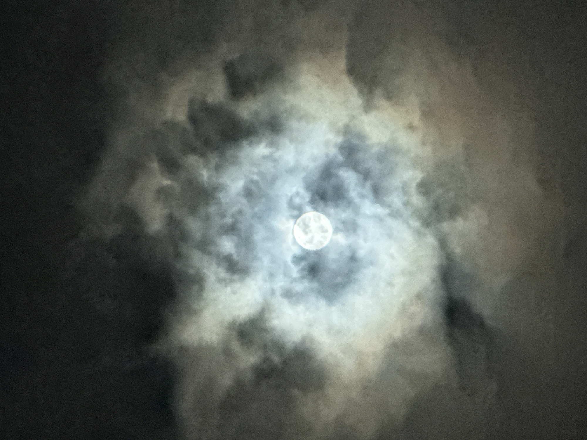 Full moon through clouds over Nha Trang, with parking garage detours