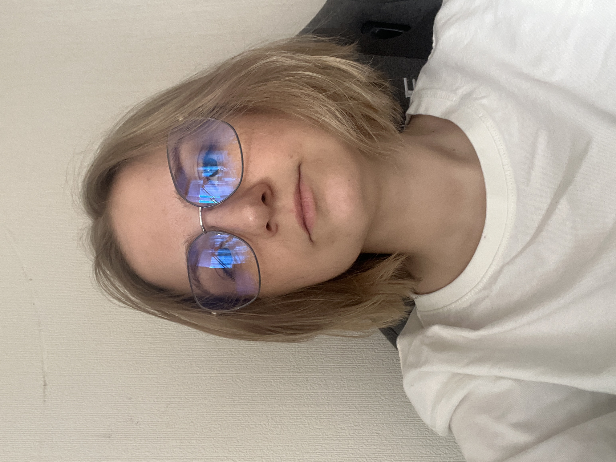 Person in glasses spotted in indoor setting in Novosibirsk