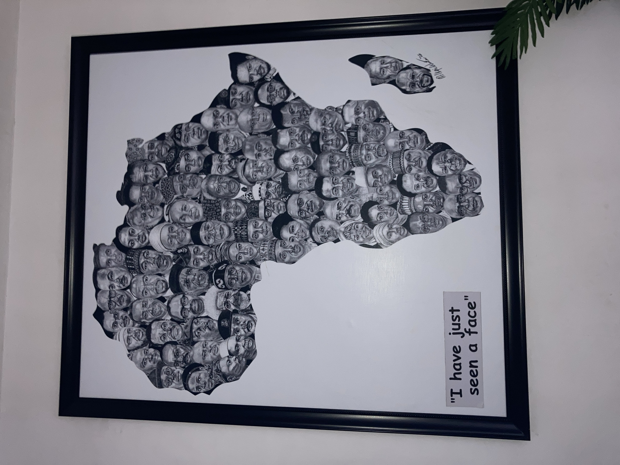 Wall gallery display featuring diverse artwork in Abuja
