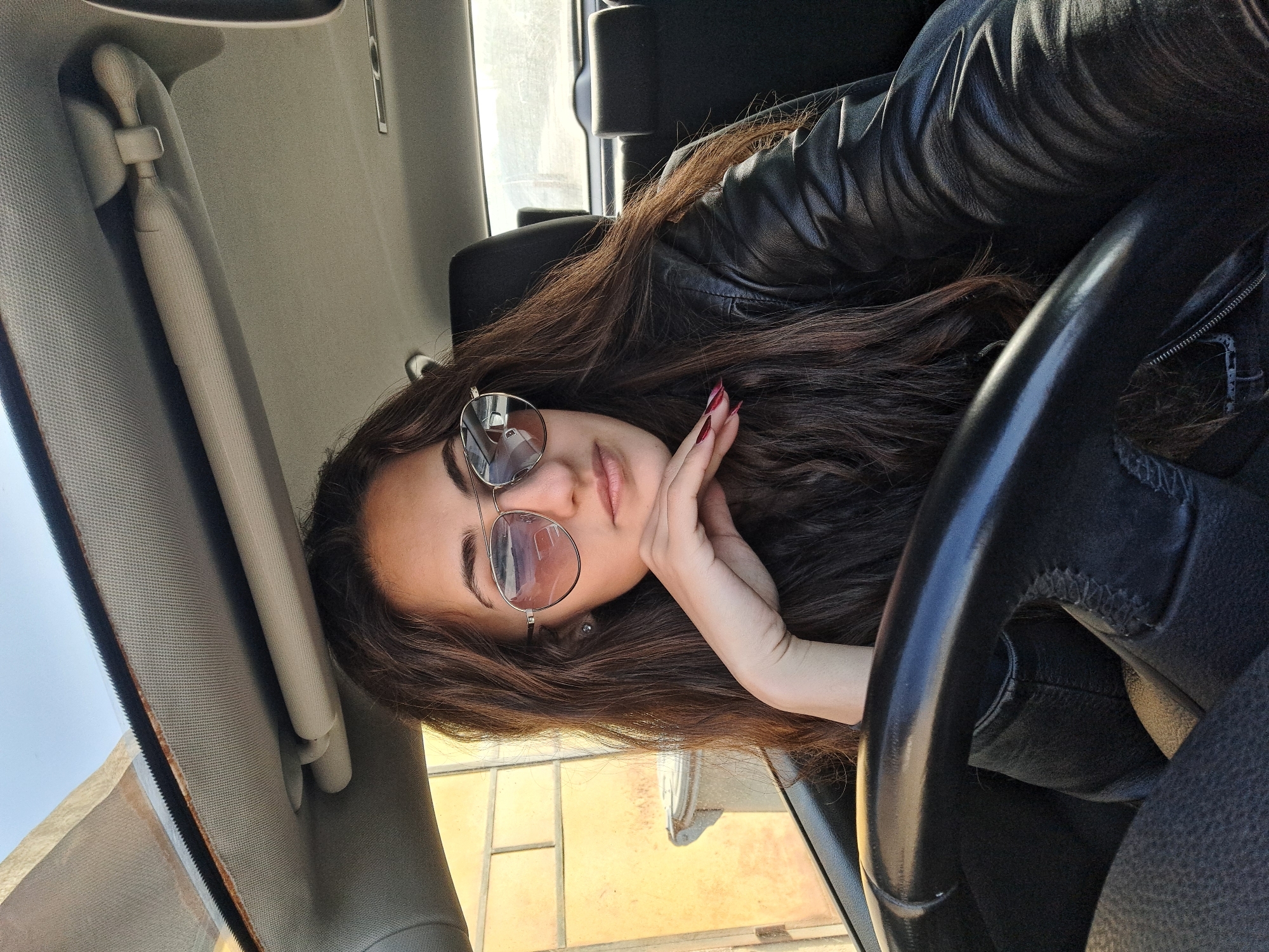 Woman photographed in car during daylight in Chepintsi, Bulgaria