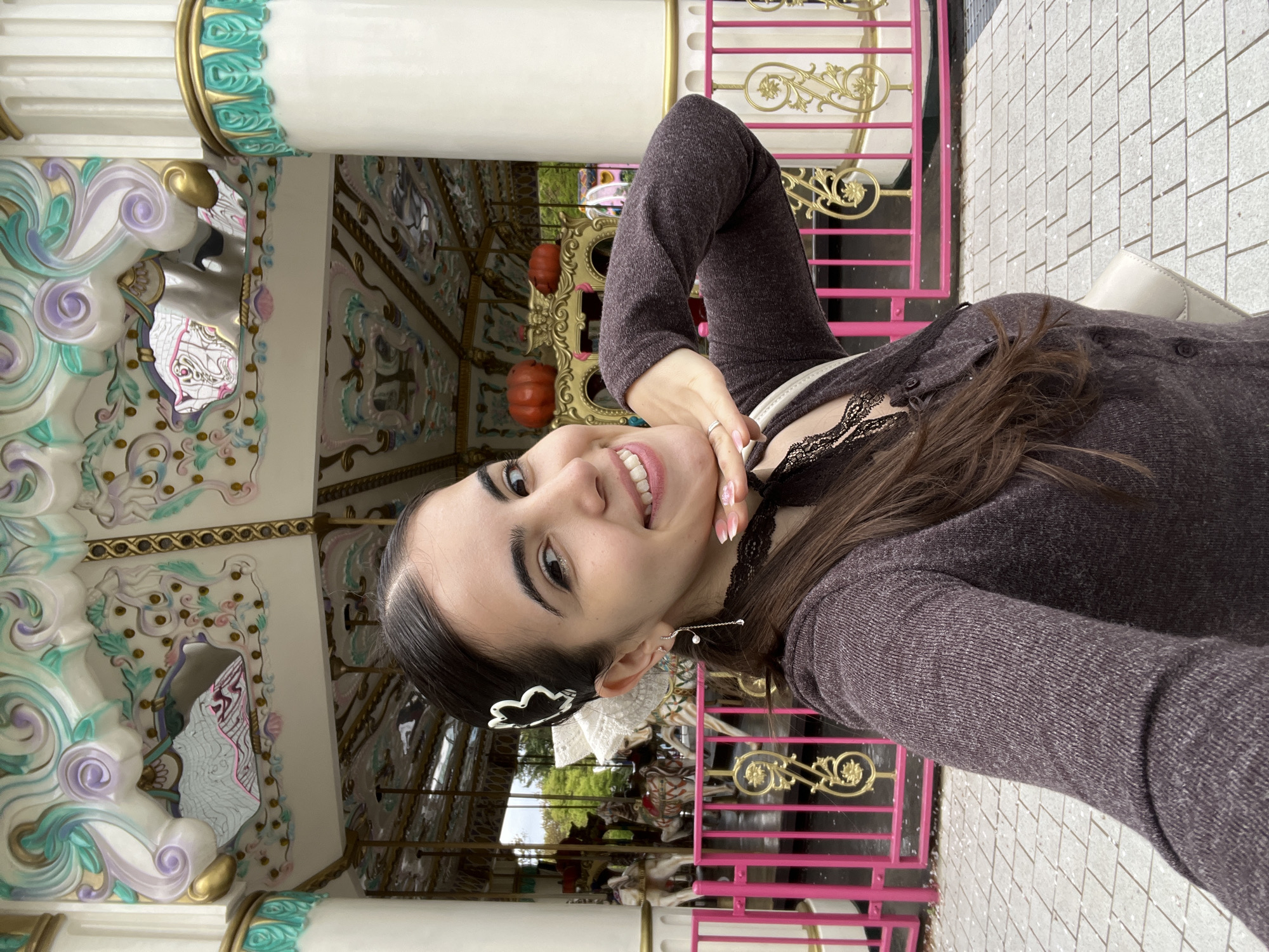 Woman poses with cartoon egg statue in Daegu