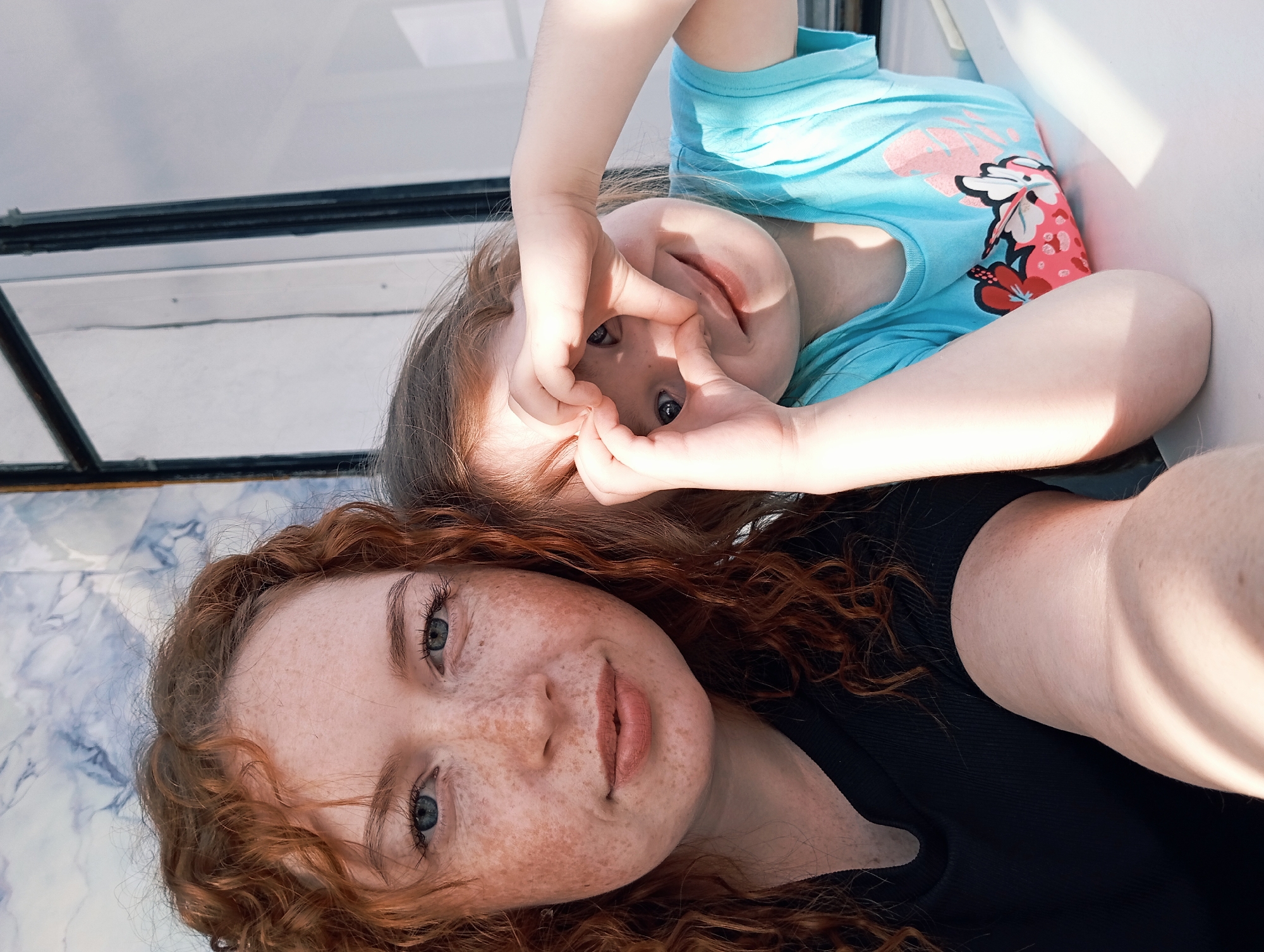Red-haired woman photographed in portrait session in rural Russia