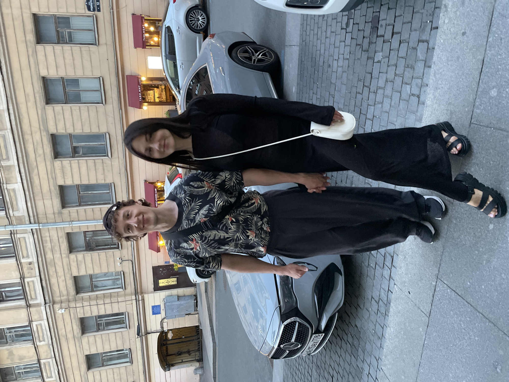 Tourists explore Saint Petersburg landmarks during summer evening hours