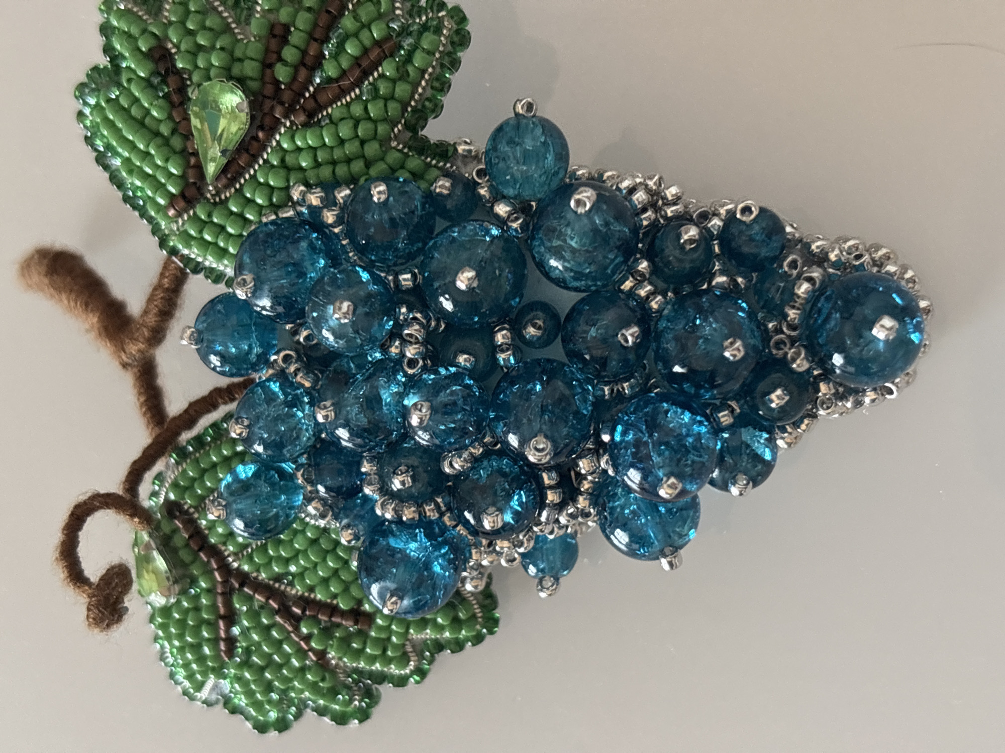 Beaded grape brooch and sleeping cat afternoon scenes