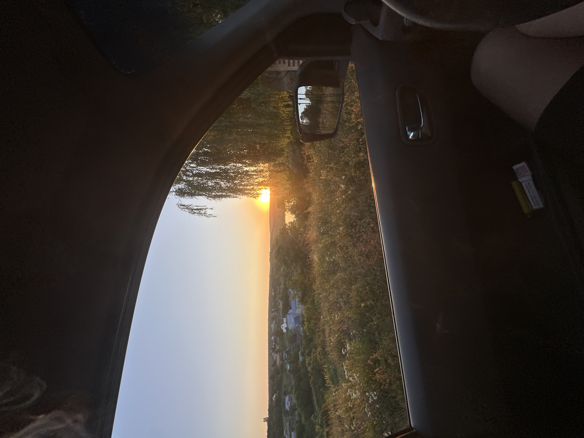 Sunset over rural Makiv, Ukraine, from a moving car