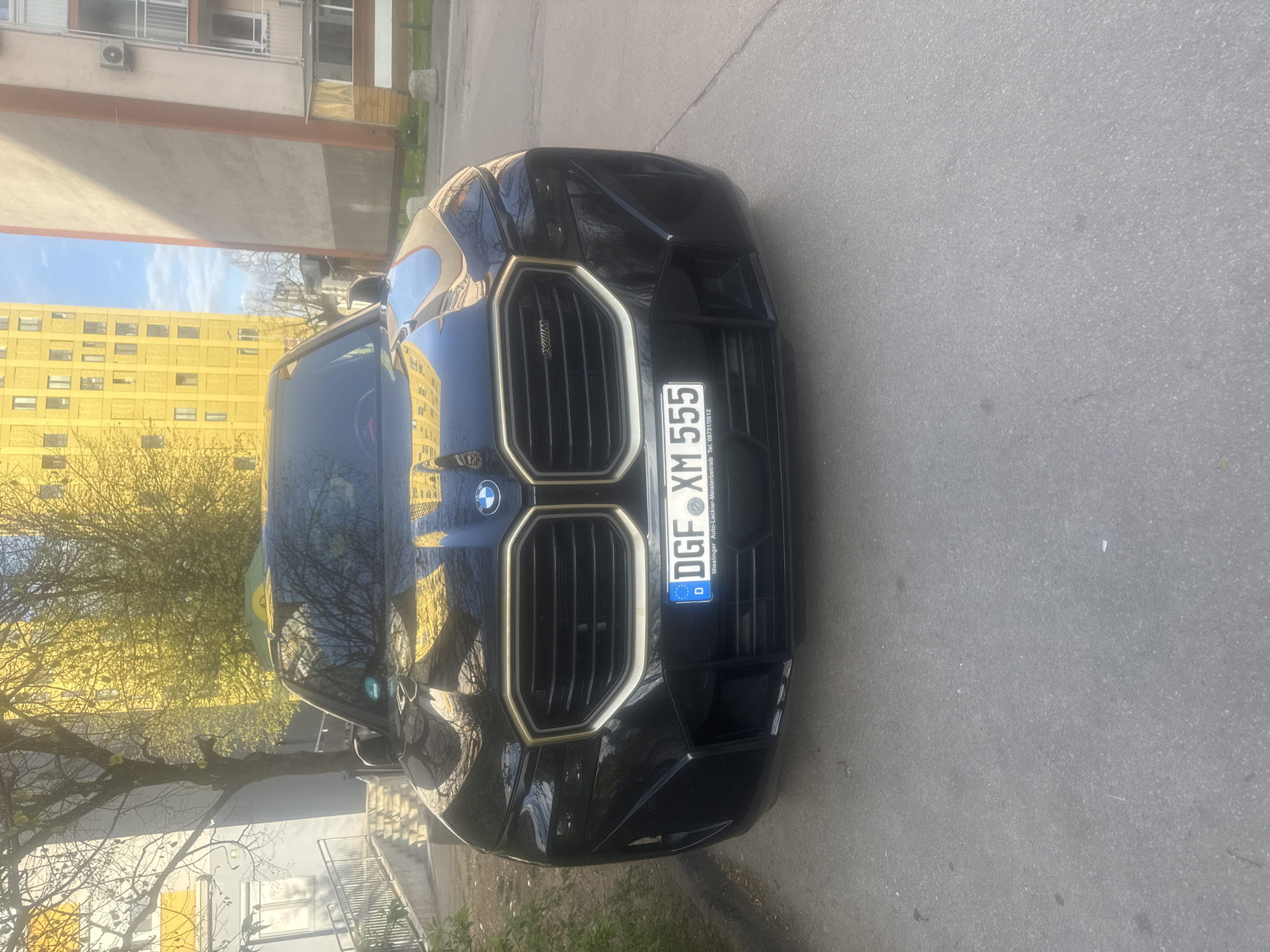 Spring magnolia blooms and luxury car spotted in Ljubljana