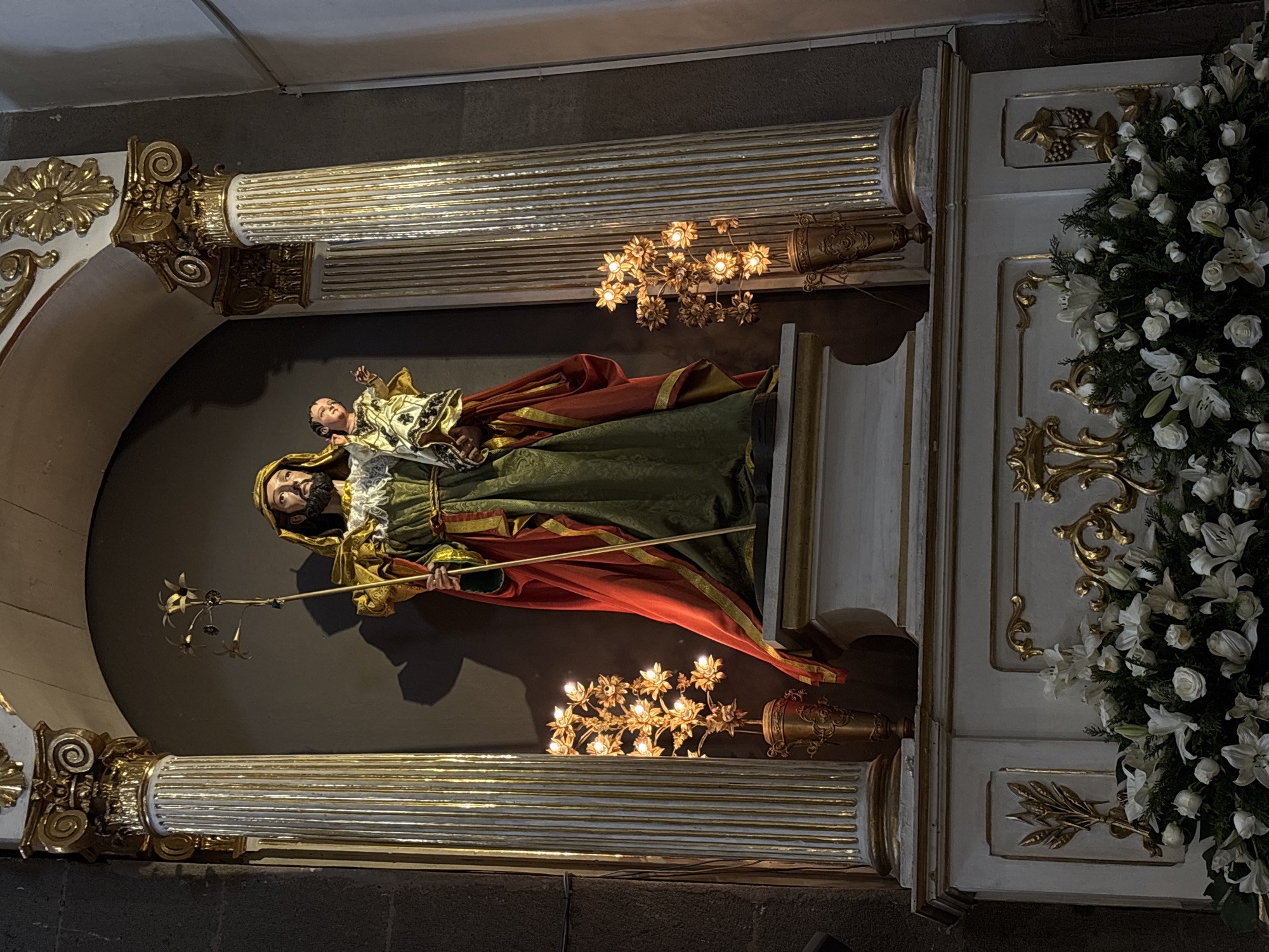 Visitor documents ornate historic church interior in Puebla, Mexico