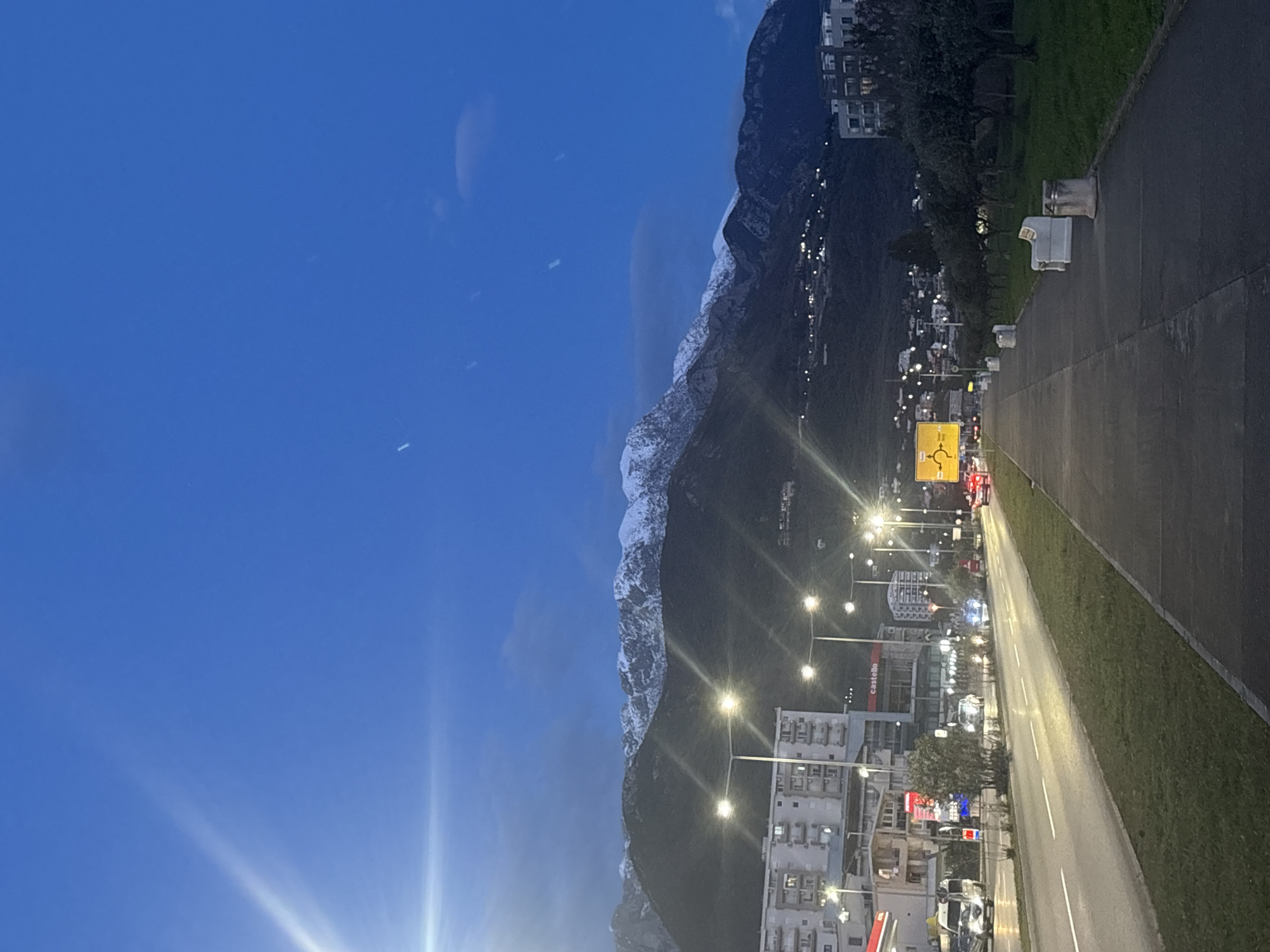 Evening streetlights illuminate commercial district in Bar, Montenegro