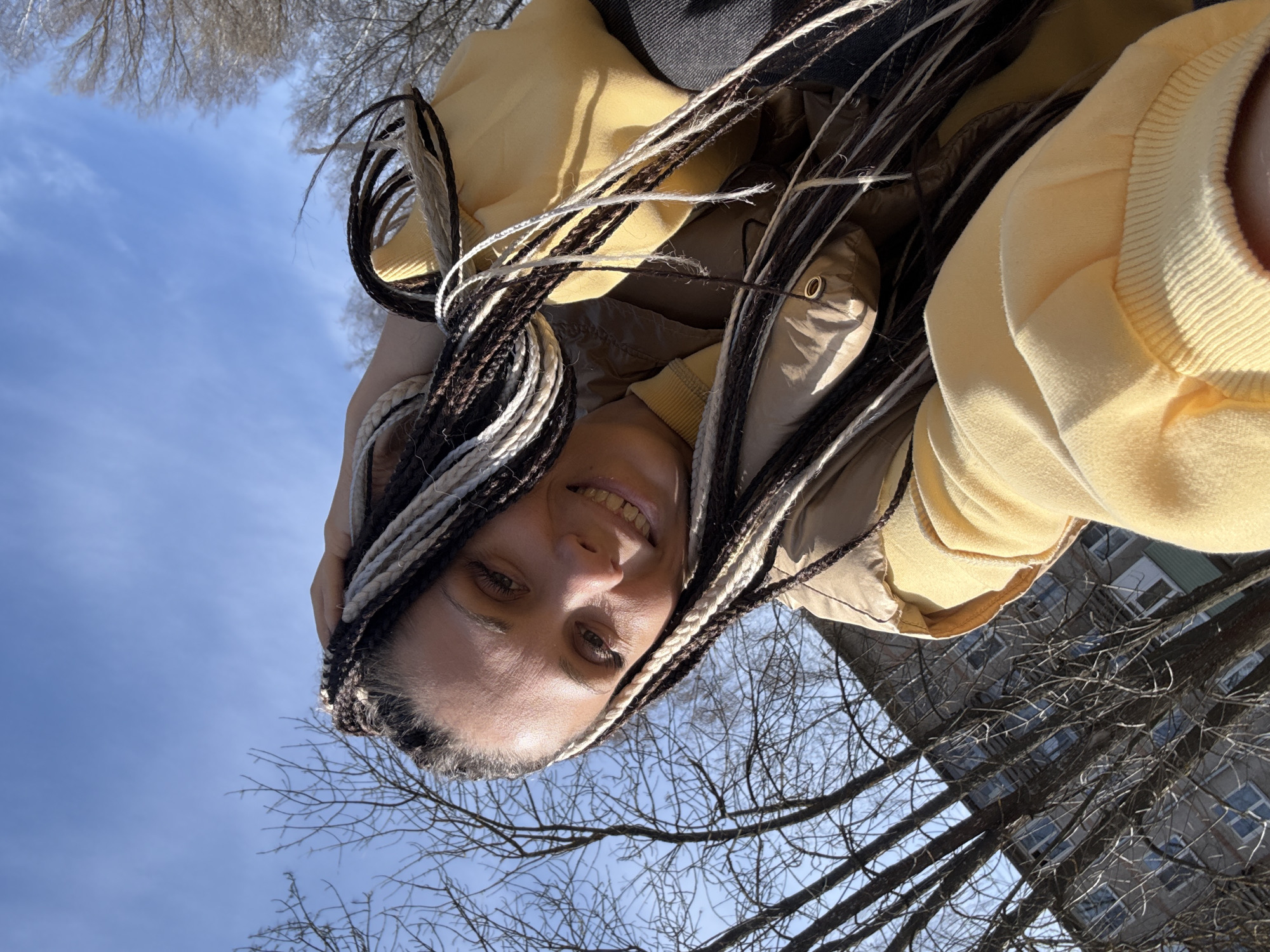 Woman with braids photographed outdoors in Rusanovo, Russia